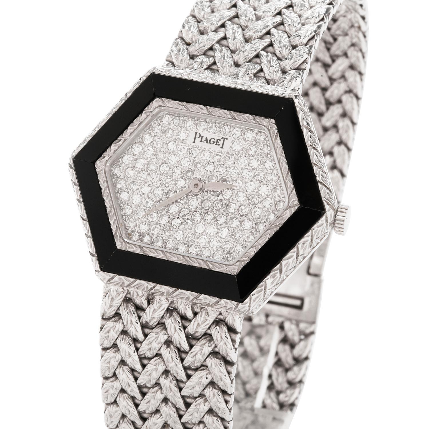 Fitted with an Onyx Bezel and Pave Diamond Dial, this Ladies Circa  early 1970 Piaget watch

is a rare find.  The watch case is particularly unique, rendered in a Hexagonal shape.

The bracelet too, is fashioned in a braided ropelike texture,