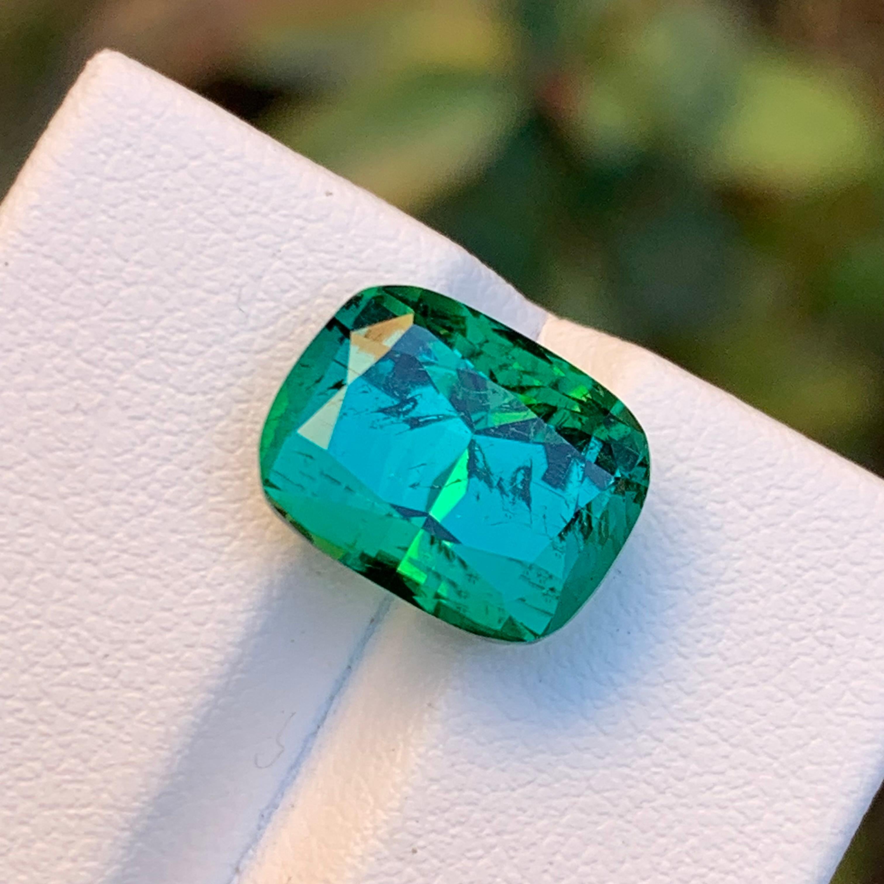 Introducing our exquisite Lagoon Green Natural Tourmaline Loose Gemstone, a rare find of top-tier quality. Meticulously cut and polished in a captivating cushion cut design, this gem boasts excellent luster and a subtle inclusion that adds