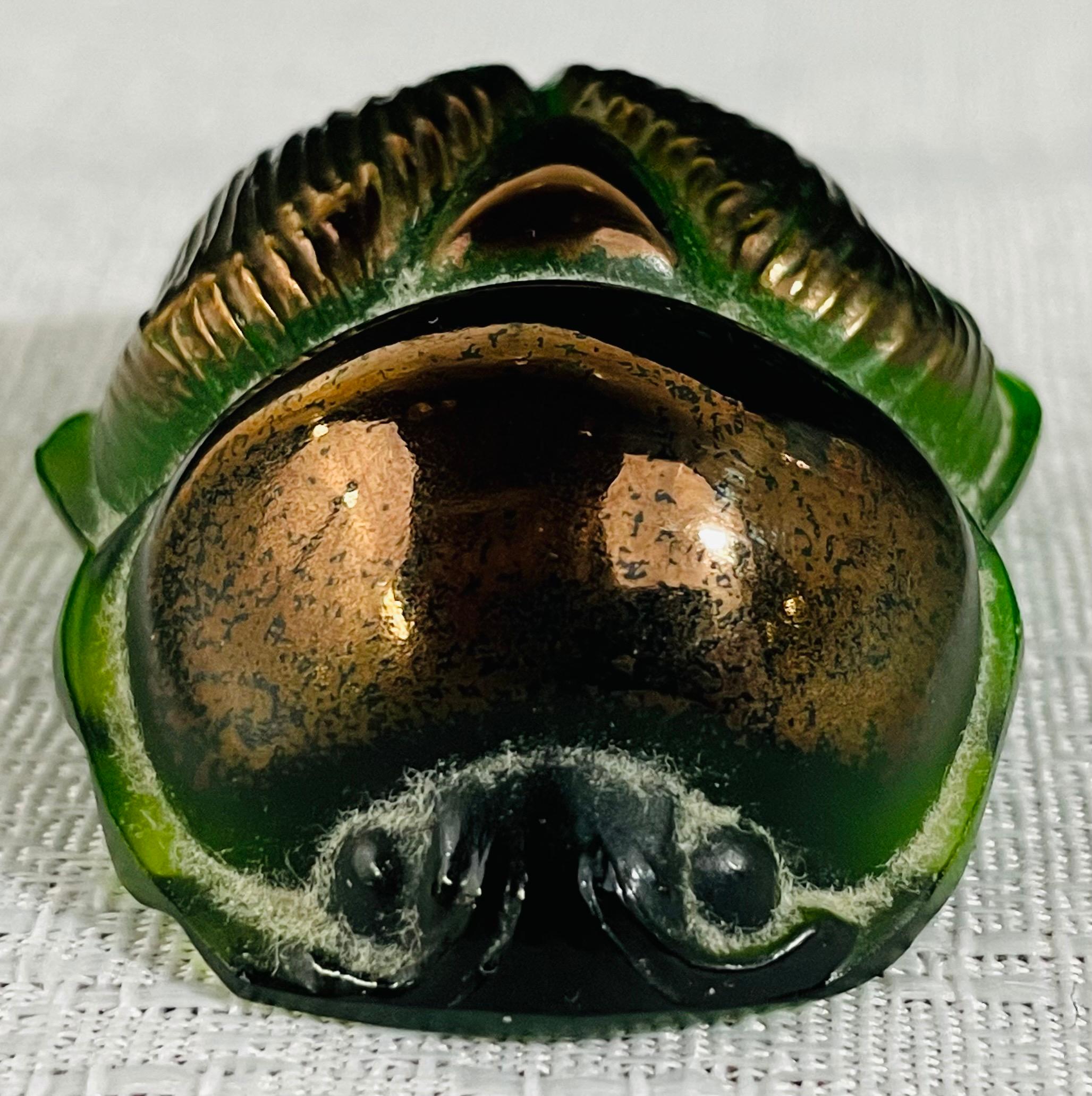 A vintage rare Lalique crystal scarab paperweight Circa 1970s in a luster green color with gold finish. The piece is engraved 