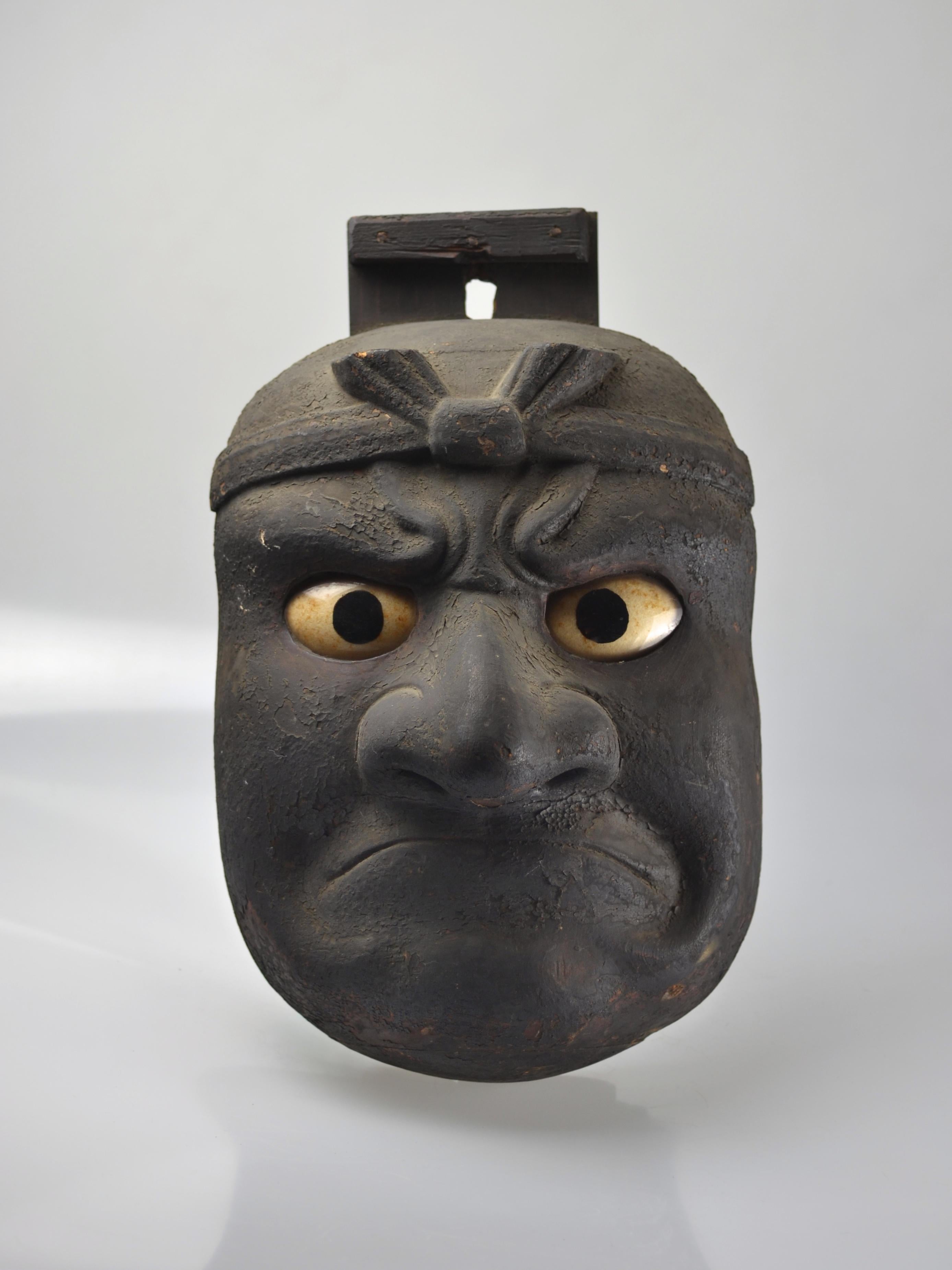 Rare, large ceremonial pilgrim hanging mask of the beshimi type. Beshimi is some sort of Tengu who protects others from evil spirits and demons. His name refers to his firmly shut mouth, that can be read as a sign of his inner determination. The