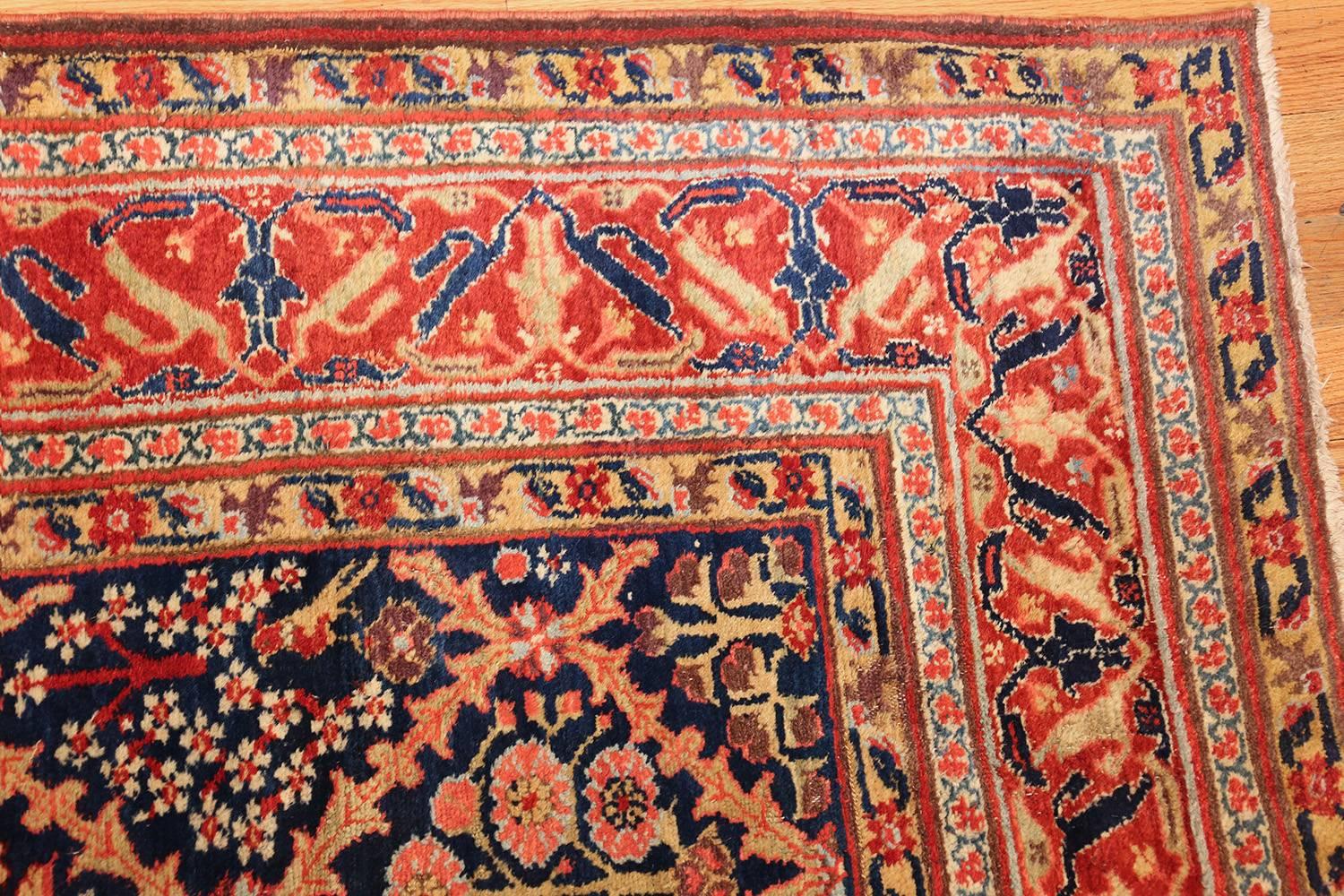 Breathtaking Rare Large Size 18th Century Antique Kurdish Shrub Design Rug, Country Of Origin / Rug Type: Persian Rug, Circa Date: 18th Century. Size: 12 ft 8 in x 18 ft (3.86 m x 5.49 m)

A latticework fills this antique Persian rug with warm,