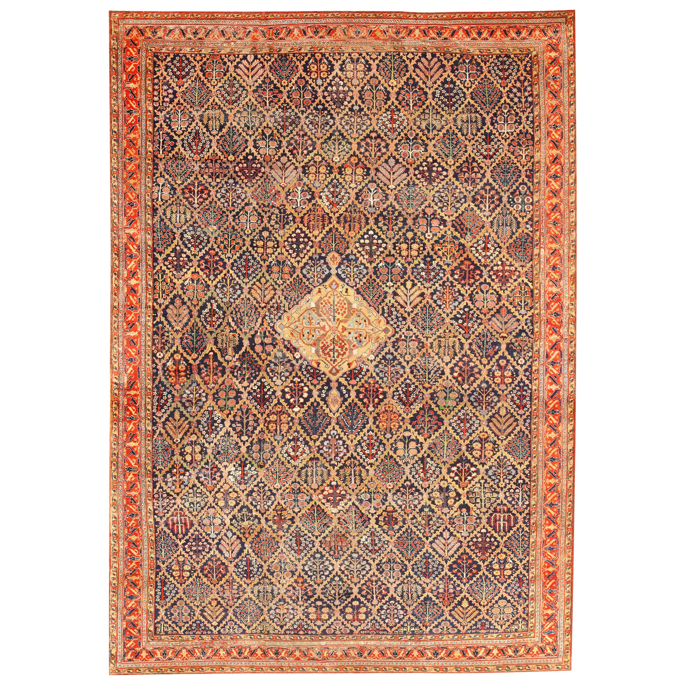 Nazmiyal Collection 18th Century Antique Kurdish Shrub Design Rug. 12' 8" x 18' 