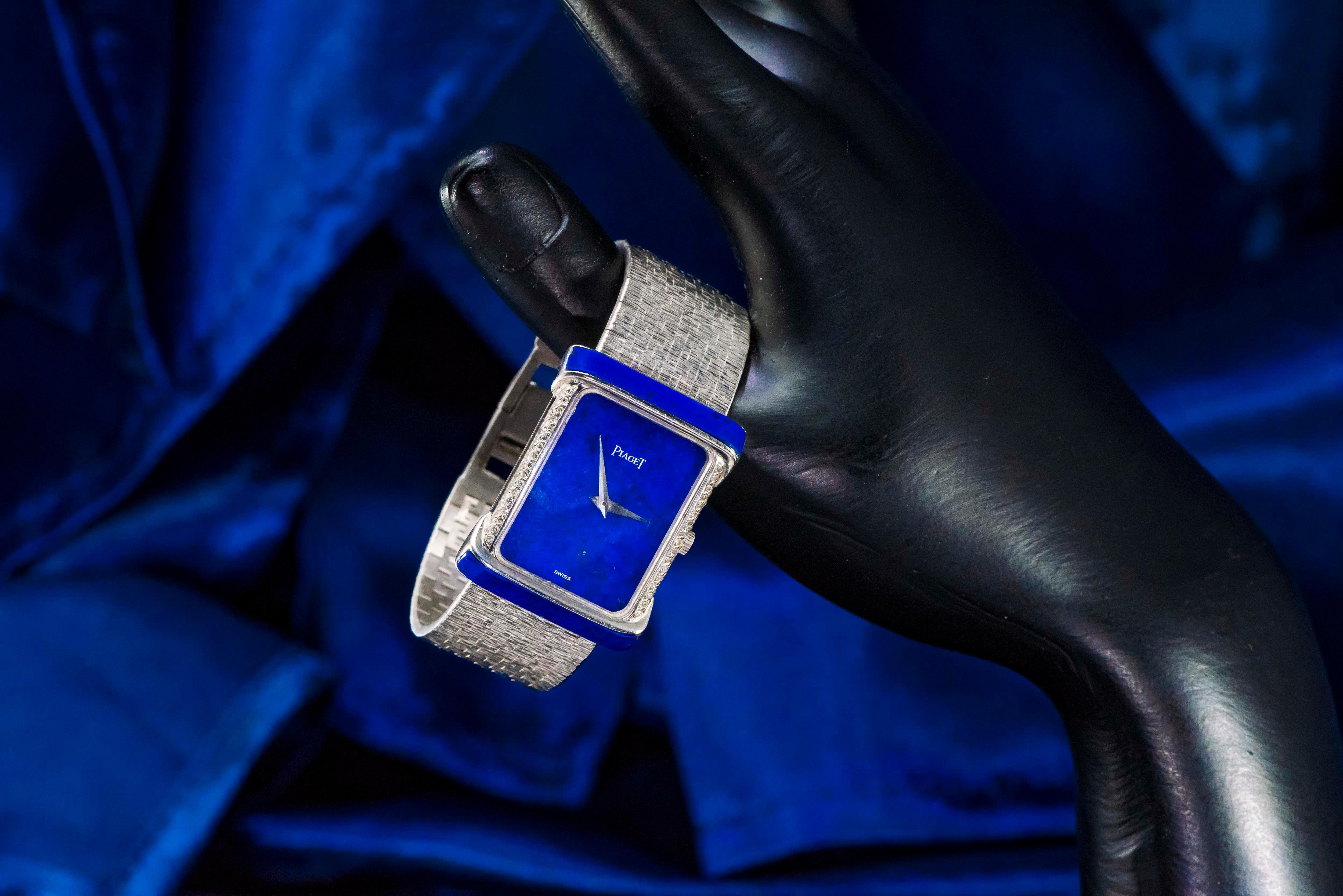 Dimensions 
34mm Long X 28mm Wide
Wrist size fits up to 170mm
*Can be resized as necessary

The present large Piaget example is an extremely unique case design for the brand which is designed with cut Vibrant Blue Lapis on both the top and bottom