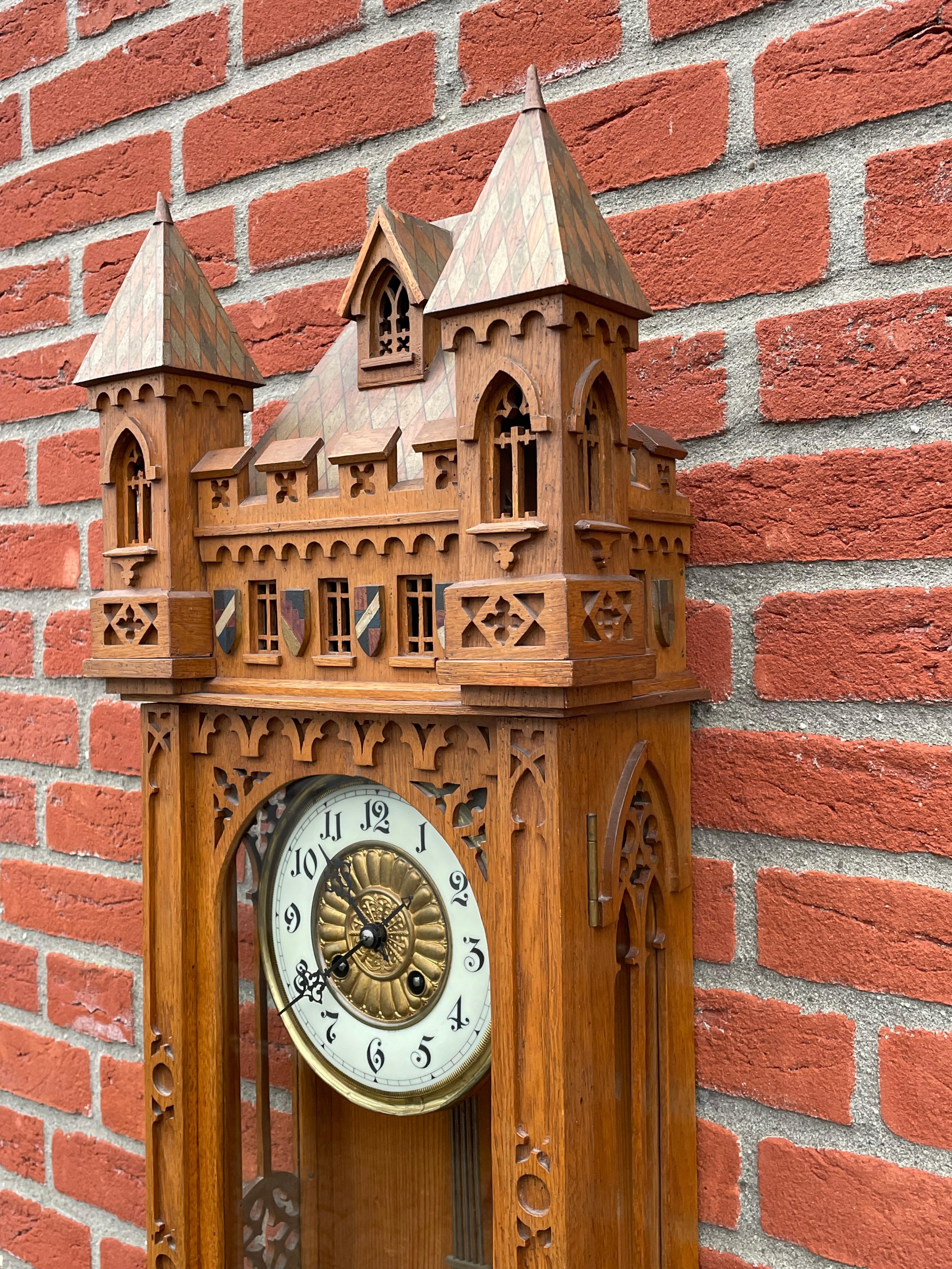 Stunning clock for the collectors of rare and truly stylish Gothic antiques.

Gothic wall clocks are a rare find and this more than three feet tall specimen is one of the tallest and the most elaborate we have seen to date. All handcrafted and hand