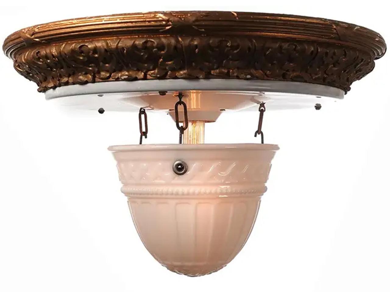 Reflectolyte flush mount fixtures have always been popular because of their unique look. The glass dome has a fluted pattern that simply hangs from 3 hooks making it easy to clean and change bulbs.. The ceiling crown is white porcelain over steel