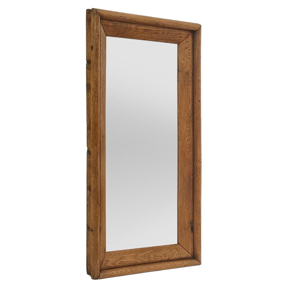 Rare large antique French mirror in solid blond oak wood from the late 19th century. Frame width: 10.5 cm / 4.13 in. Modern glass mirror. Wooden rear panel.