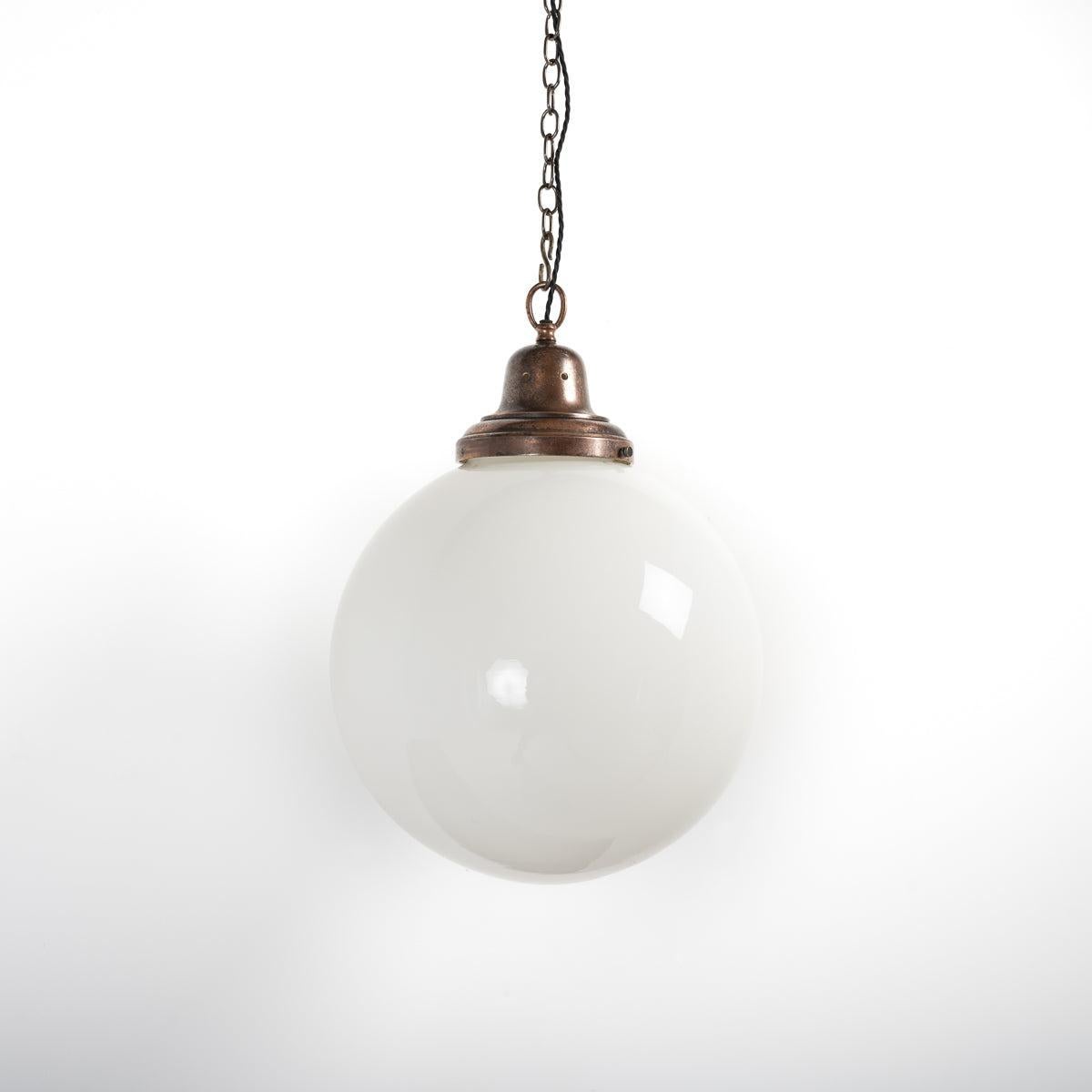 Rare extra large size antique opaline globe pendant light. 
A rare 400mm large diameter globe complete with original cast copper gallery.

British made circa 1920.

Reclaimed from a Yorkshire textile mill.

These light work pretty much