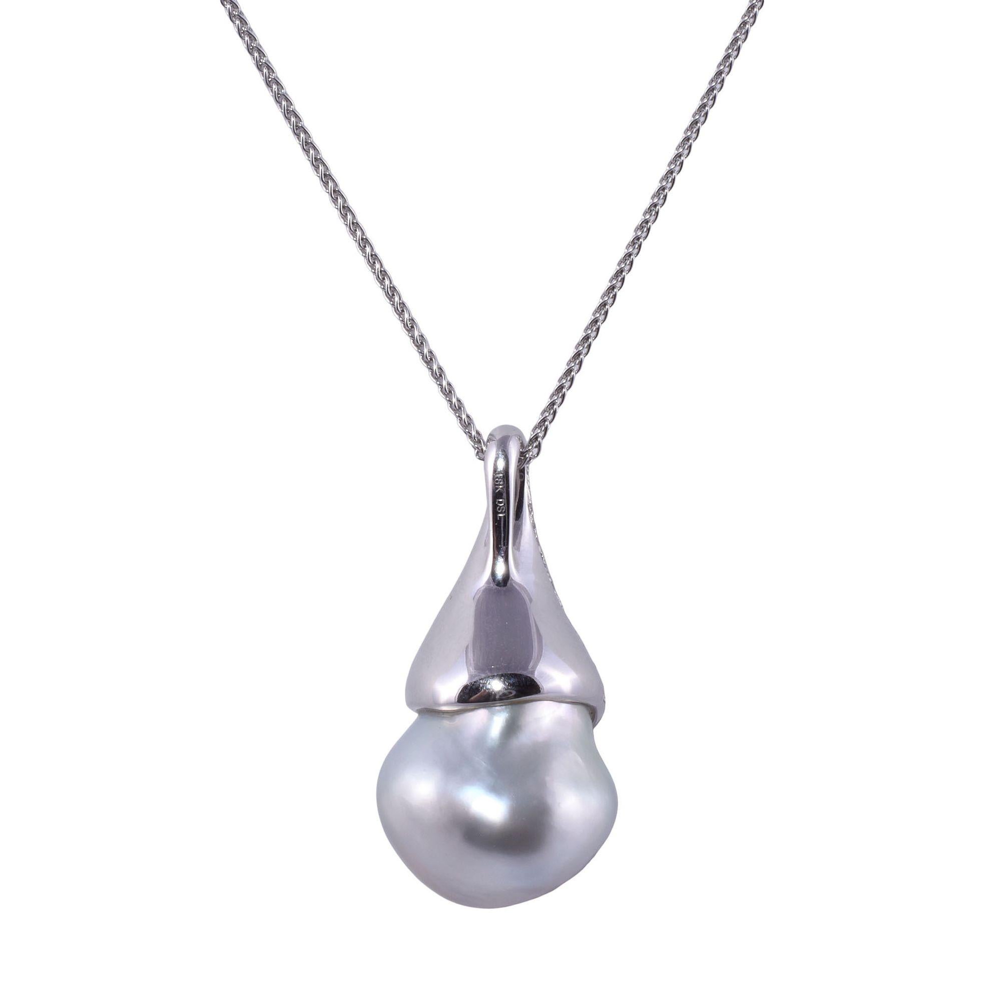 Estate rare large baroque South Seas pearl pendant necklace. This 18 karat white gold pendant features a large baroque cultured South Seas pearl with pink and blue overtones. The pearl measures 18.3mm x 15.15mm. Pearls of this size are quite rare.