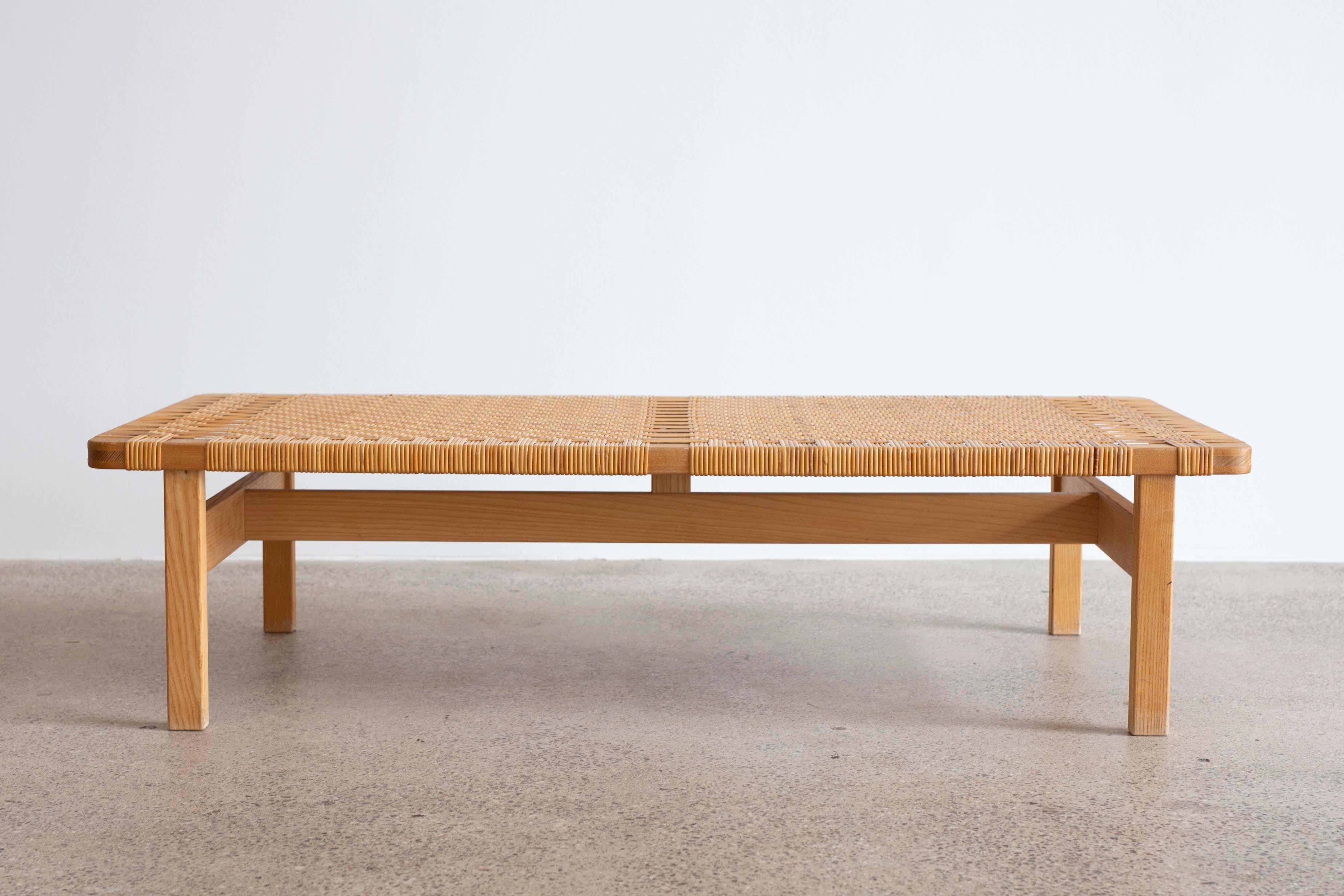 Rare large version of the Børge Mogensen bench. 

Original patinated oak and woven cane. Designed by Børge Mogensen 1955 and made at Fredericia Stolefabrik, Denmark.

Very fine condition.