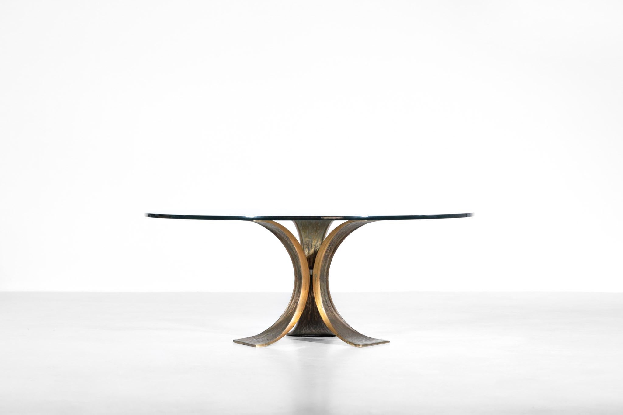 Large coffee table composed of bronze structure with round glass on the top. Really nice manufacture and design.