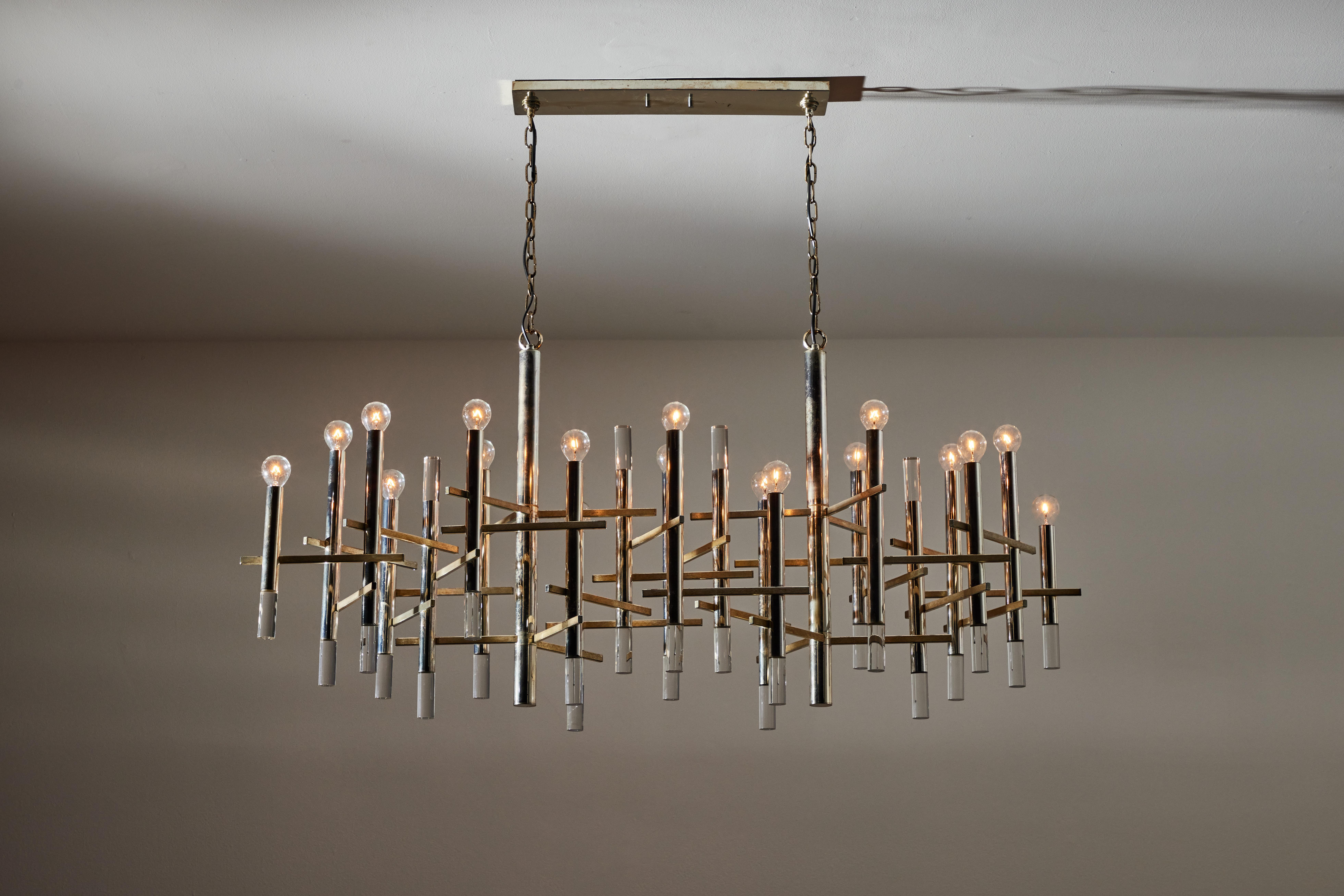 Rare large chandelier by Gaetano Sciolari. Designed and manufactured in Italy, circa 1960's. Brushed aluminum and polished nickel? original canopy. Wired for U.S. standards. We recommend eighteen E14 10w maximum bulbs. Bulbs not included.