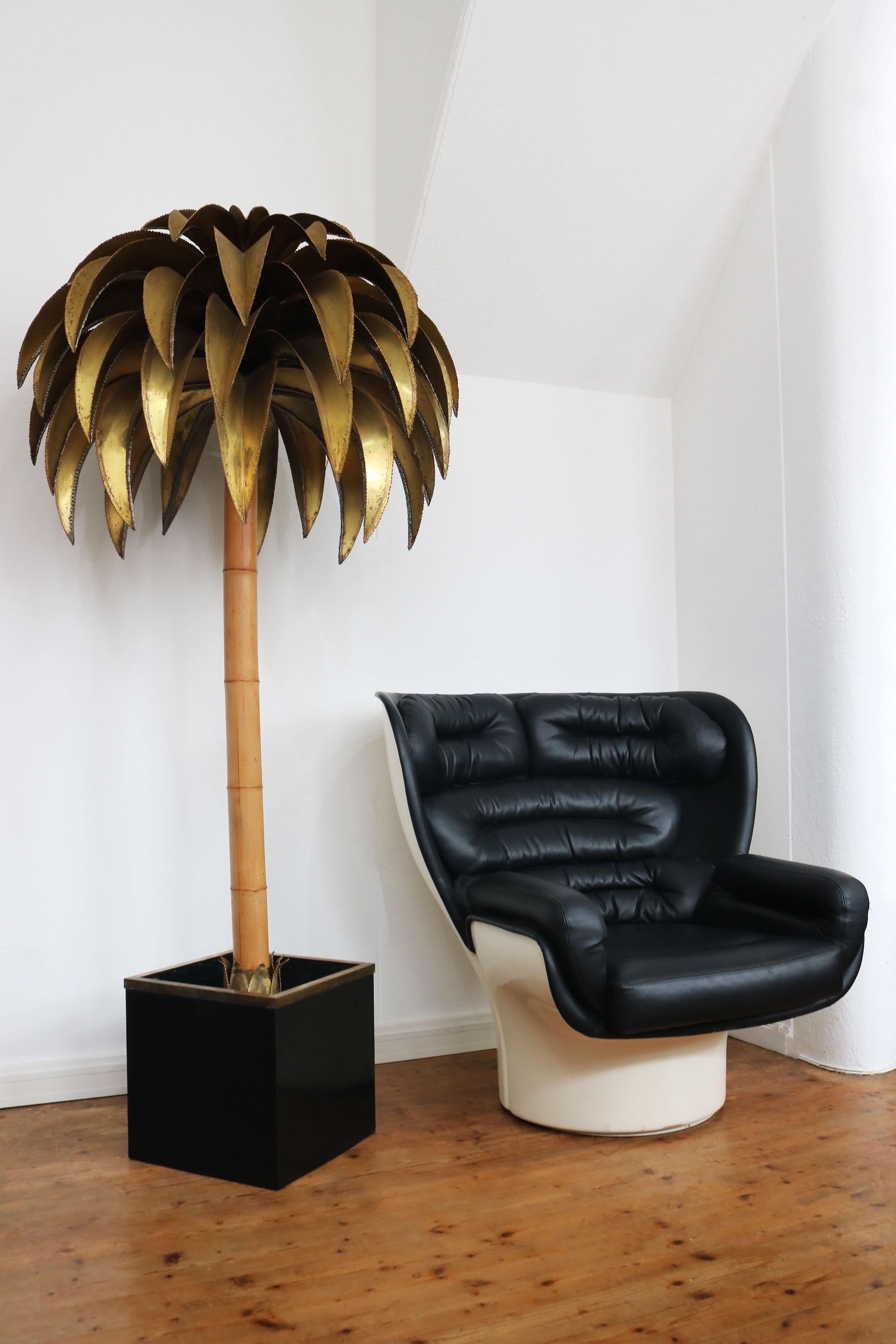 Discover a rare gem of mid-century modern design with the Christian Techoueyres Palm floor lamp for Maison Jansen, crafted in 1970. This stunning piece stands out with its grand scale and exquisite craftsmanship, blending luxurious brass with