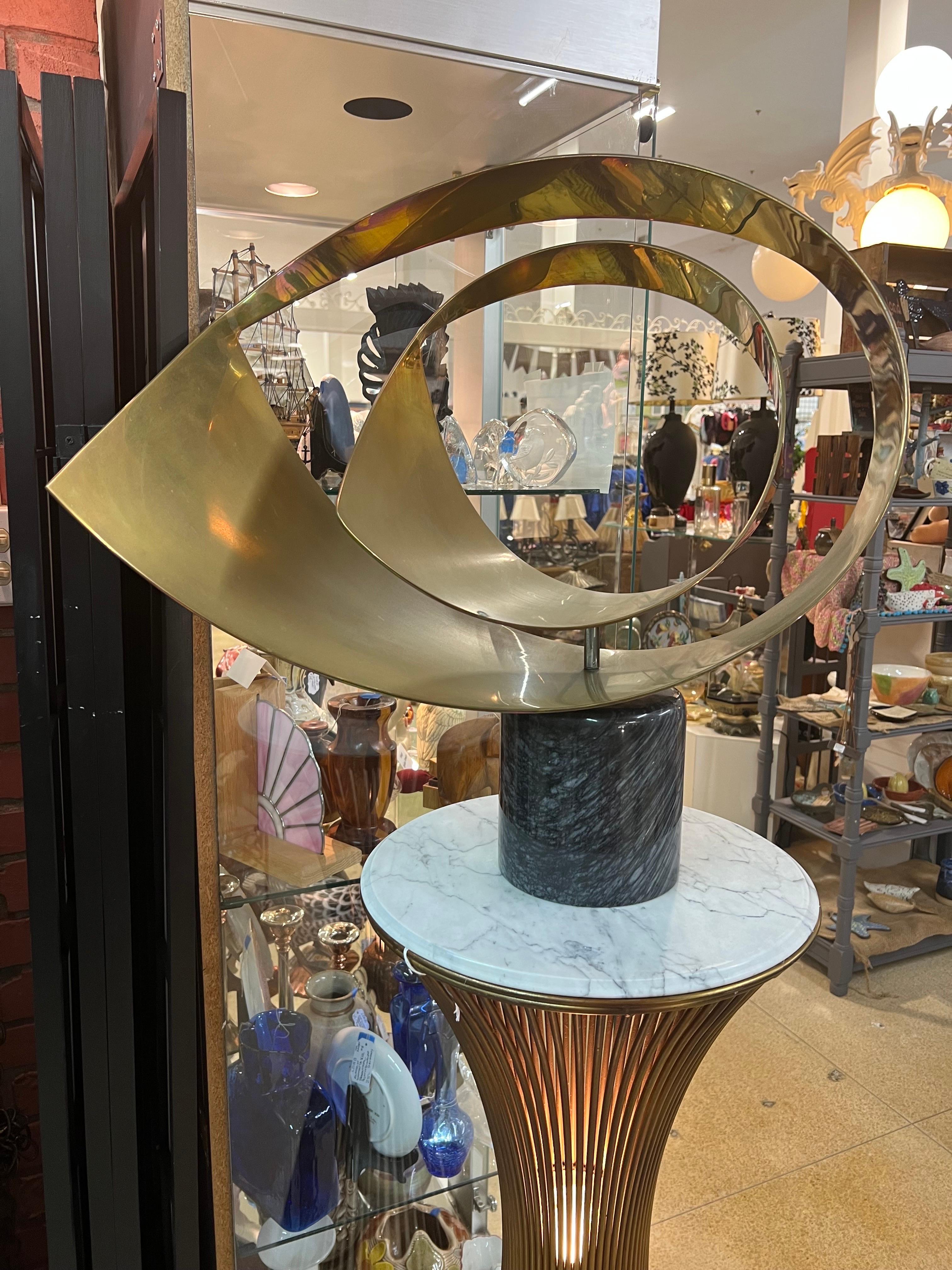 Rare Large Curtis Jere Abstract Brass and Marble Sculpture. Amorphic articulating sculpture that can rotate on an axis . Great addition to any modern home. Original Curtis Jere Artisan House sticker on base. The Black Marble Base is 6