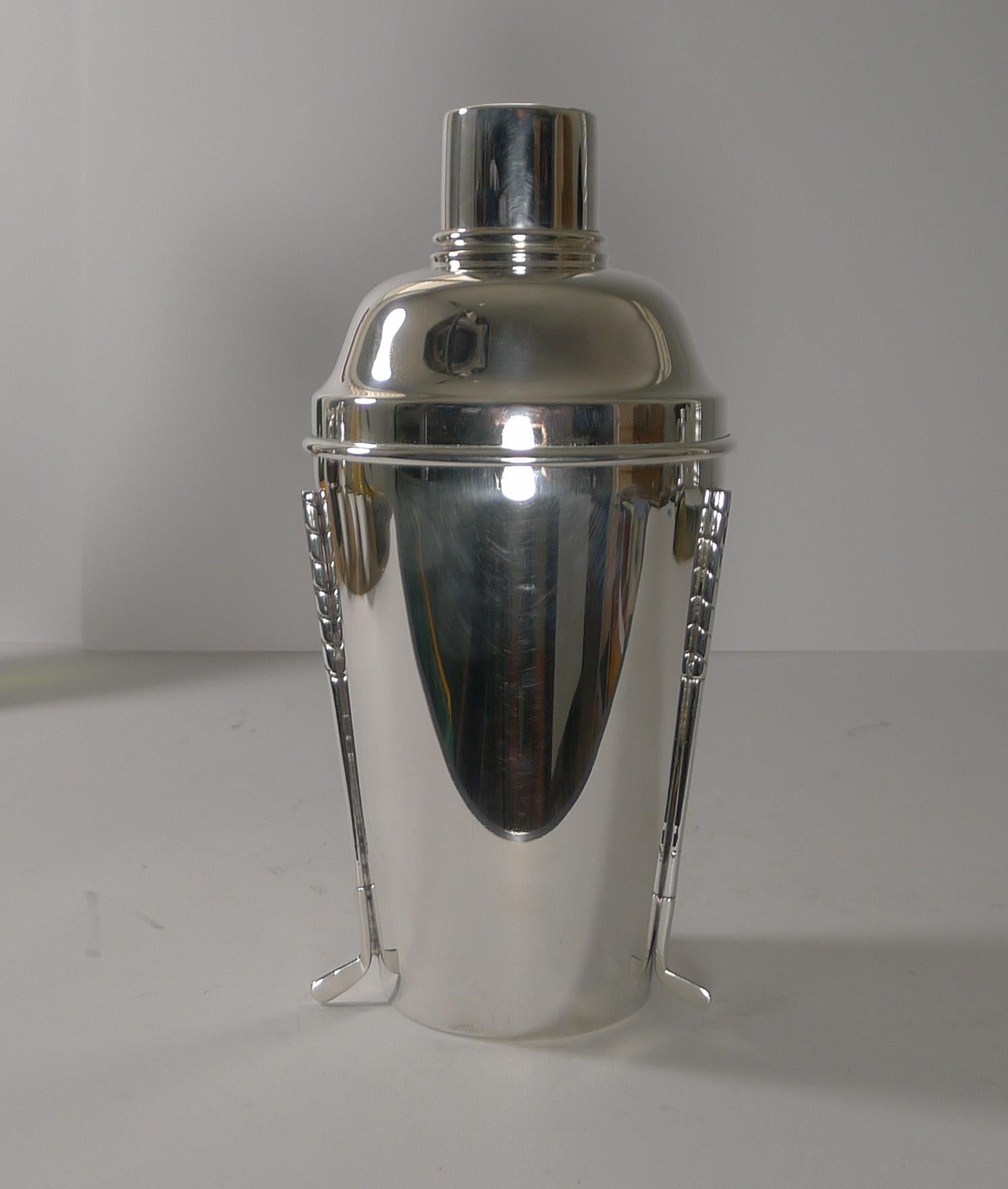 A rare and magnificent Golf Club cocktail shaker made in silver plate by the famous Sheffield silversmith, Walker & Hall, fully marked on the underside.

The body is mounted with three golf clubs, very rarely found and this one is a good large