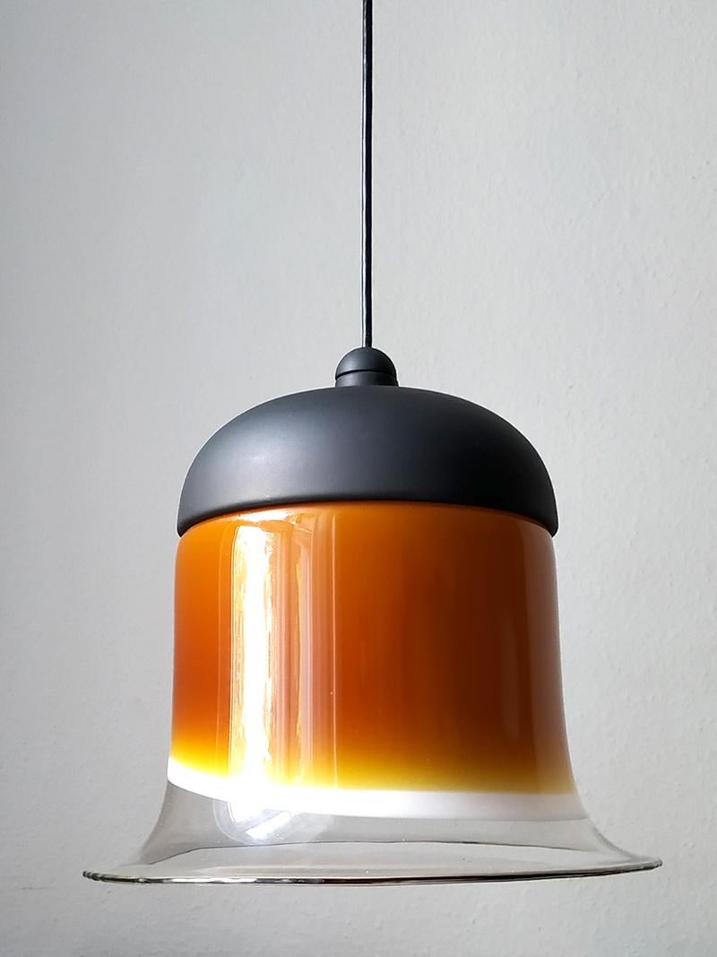 Wonderful hand blown multi-color glass and black lacquered metal pendant.
Germany, 1960s.
Measures: Glass/body D 13.8 in, H 13.8 in
Lamp sockets: 1x E27 (US E26).
   
