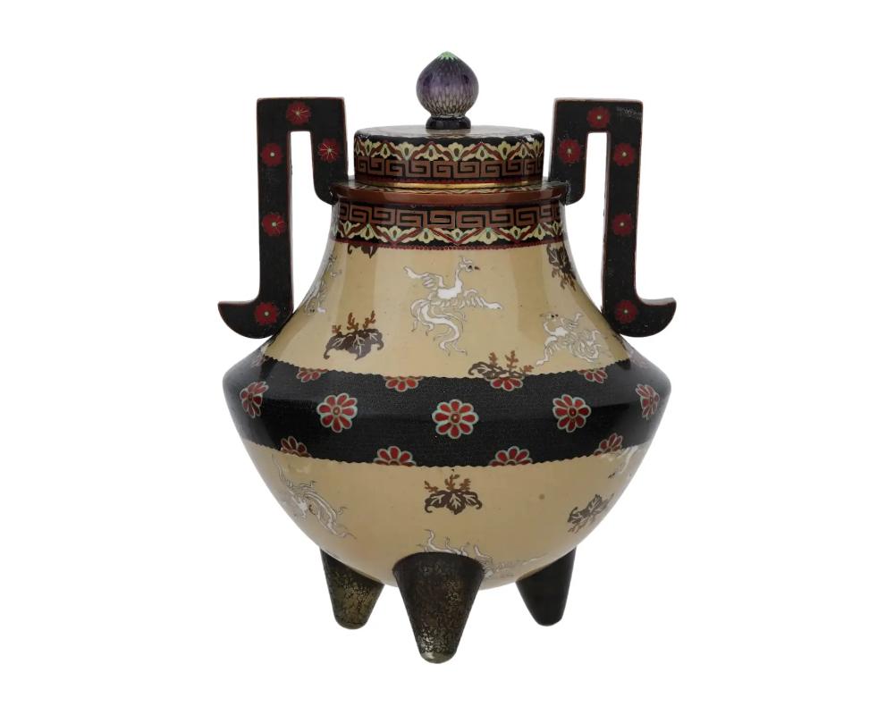 A very fine quality large antique Japanese cloisonne tripod koro censer decorated with polychrome cloisonne enamel depicting stylized phoenix birds, paulownia and chrysanthemum flowers, the top rim and lid are decorated with meander bands and floral
