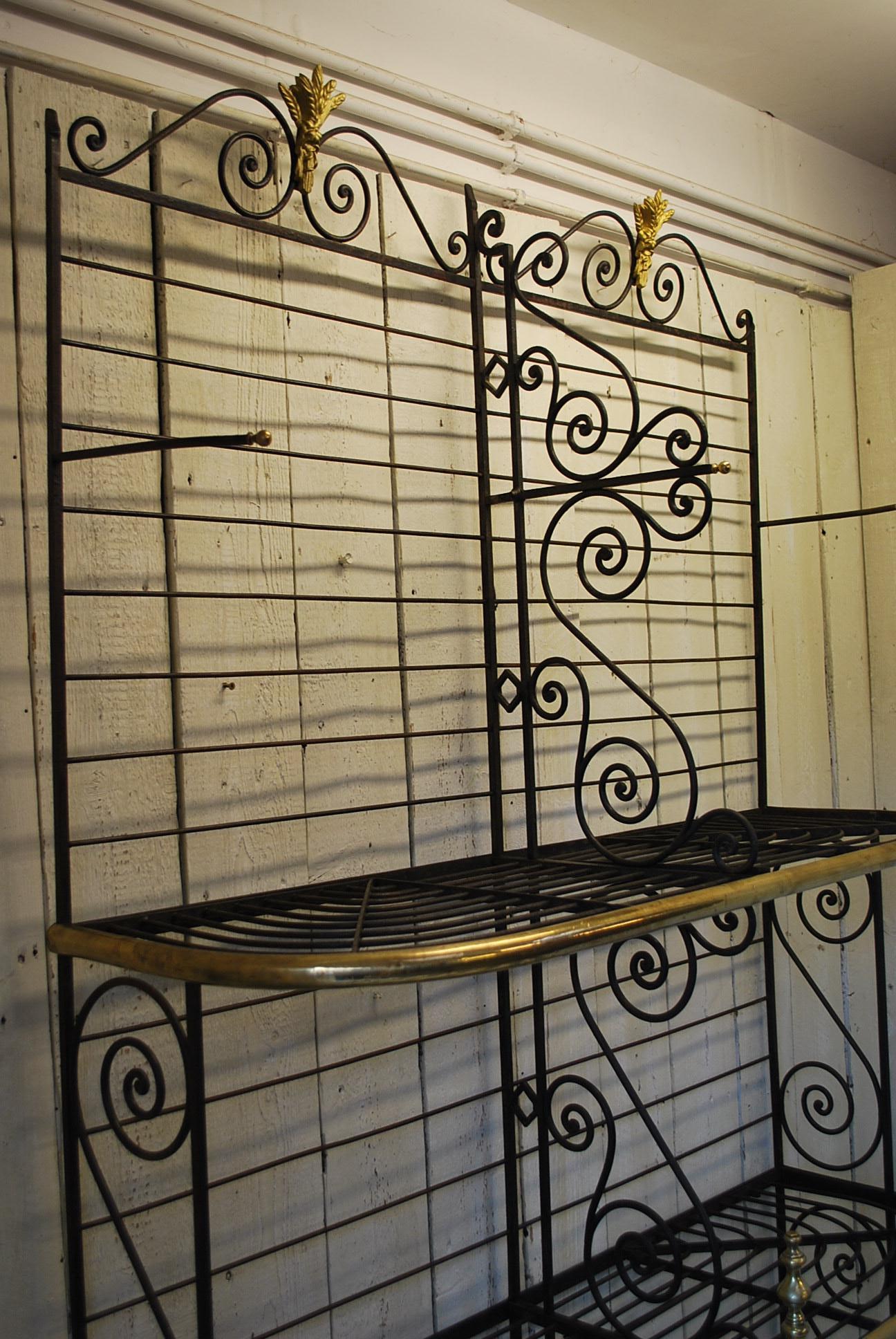 A very rare and unusual French antique shop display bakers Stand. Made in metal with fancy shaped sides and brass edging and embellished with wheatsheaf motifs. 

Ideal in a house or commercial premises. The six shelves drop into place. These are