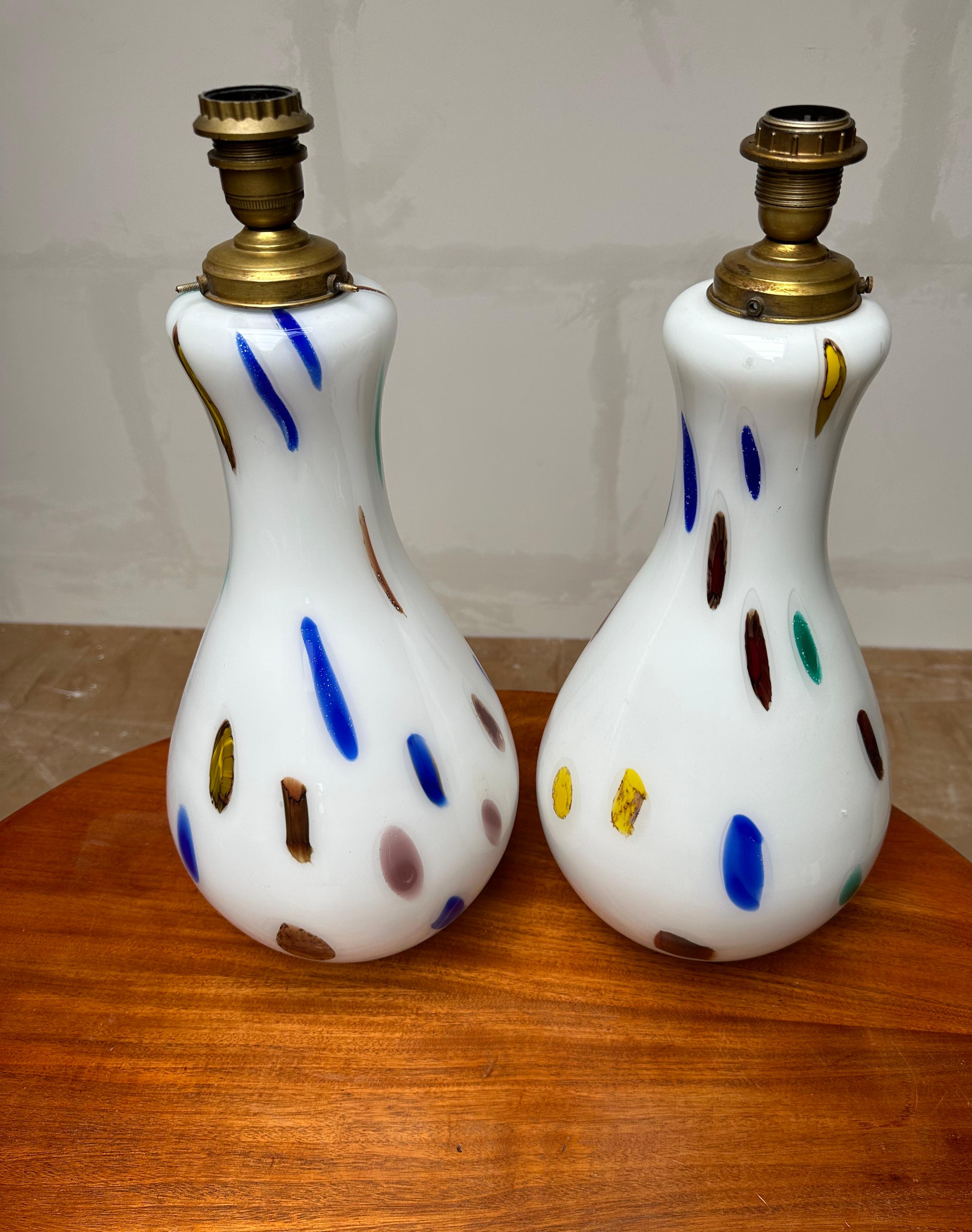 Impressive design, large size, mouth blown glass art table lights.

This unique and very impressive pair of handmade, glass art table lamps is another one of our recent great finds. With their large size and timeless design these Italian works of