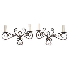 Rare large pair of French wrought iron sconces