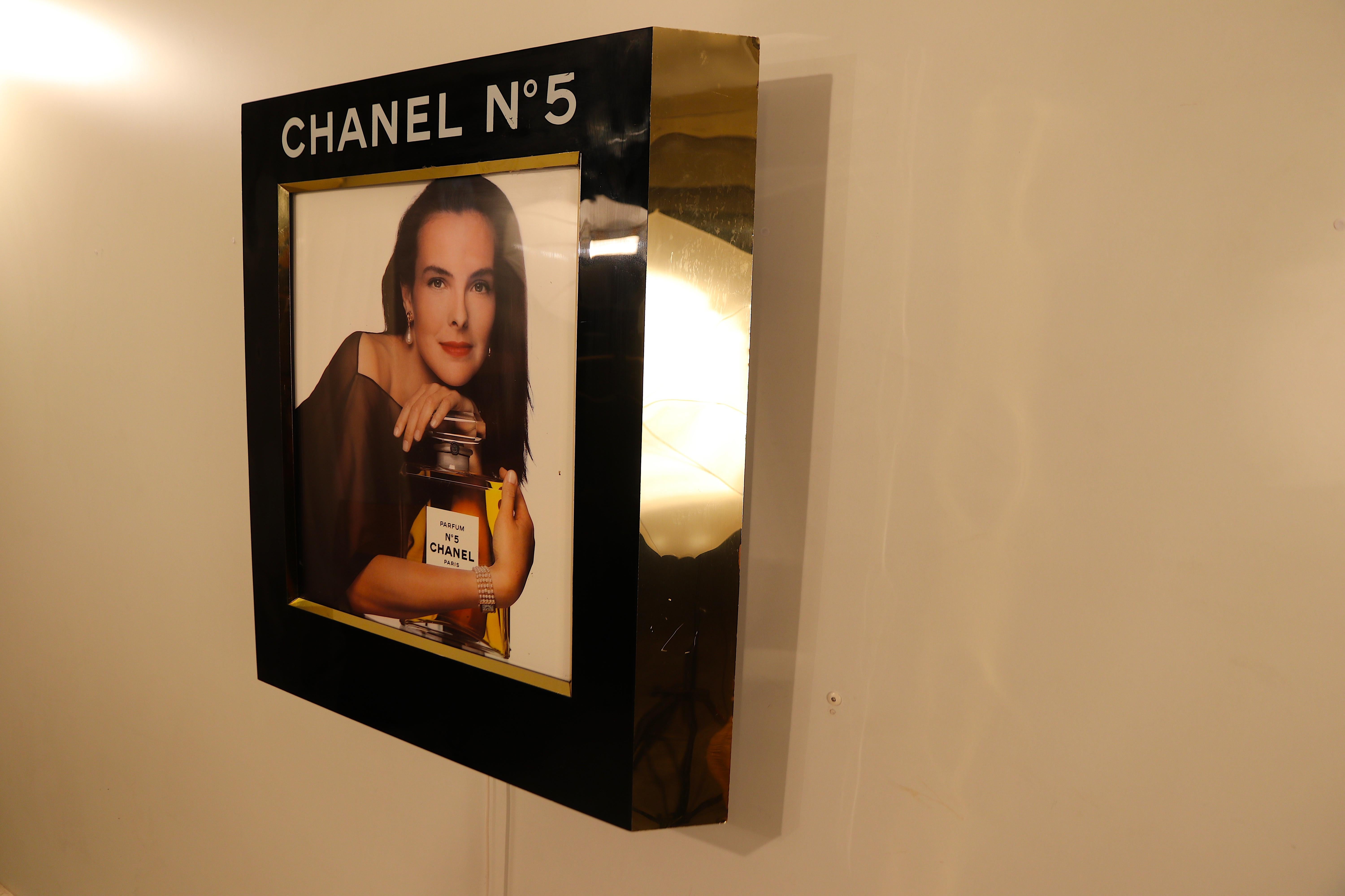 Wonderful back-lit original wall-mounted Chanel advertisement display formerly used in the perfume stores at the business jet-only airport 