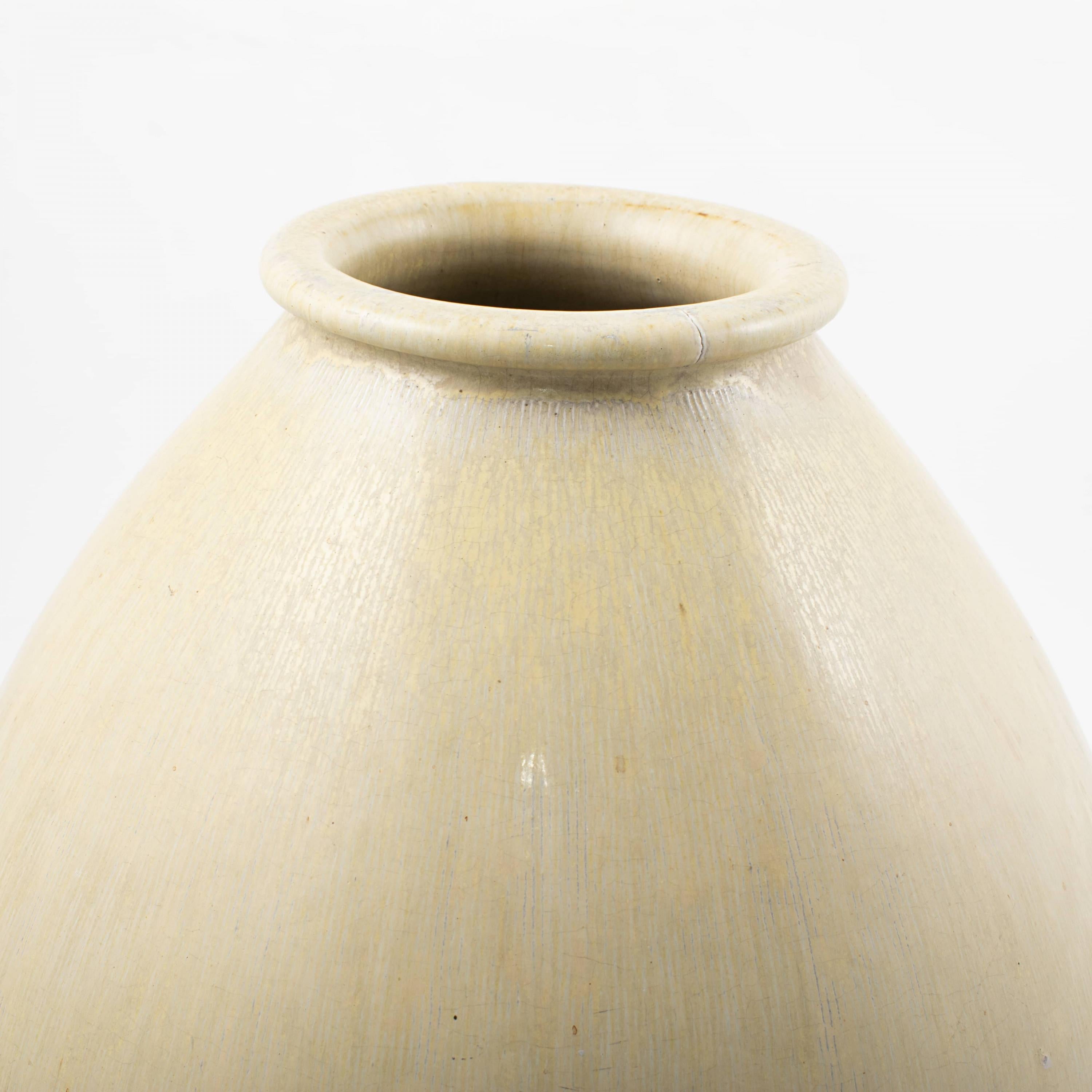 Rare large vase made at Saxbo in Denmark. One of a kind. Measure: H: 42 CM.
Stoneware decorated with light ochre glaze.
Designed by the Danish ceramist Natalia Krebs, c. 1950. With stamp.

In great condition but with two small natural cracks at