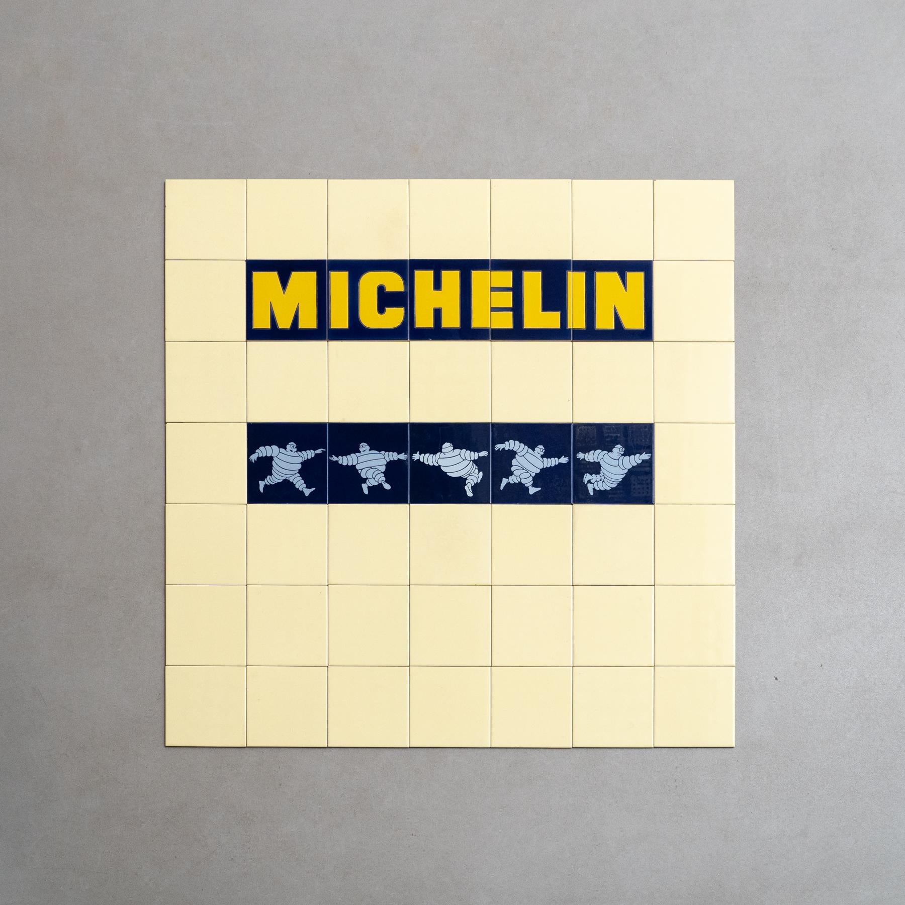 Dive into a nostalgic journey with this rare and unique large set of Michelin Man tiles, crafted by an unknown manufacturer in Spain circa 1960. The set comprises the complete series of 5 iconic Michelin Blue Tiles, surrounded by original yellow