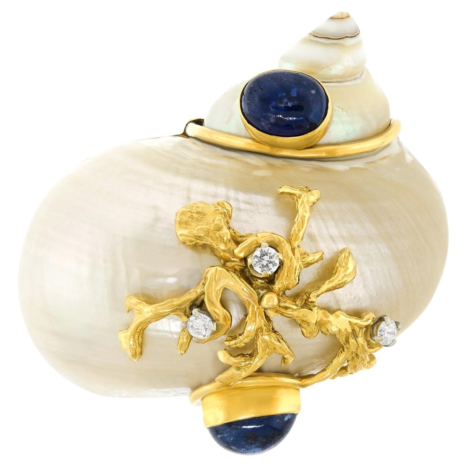 Rare grande broche Seaman Schepps des années soixante-dix montée sur or et saphir