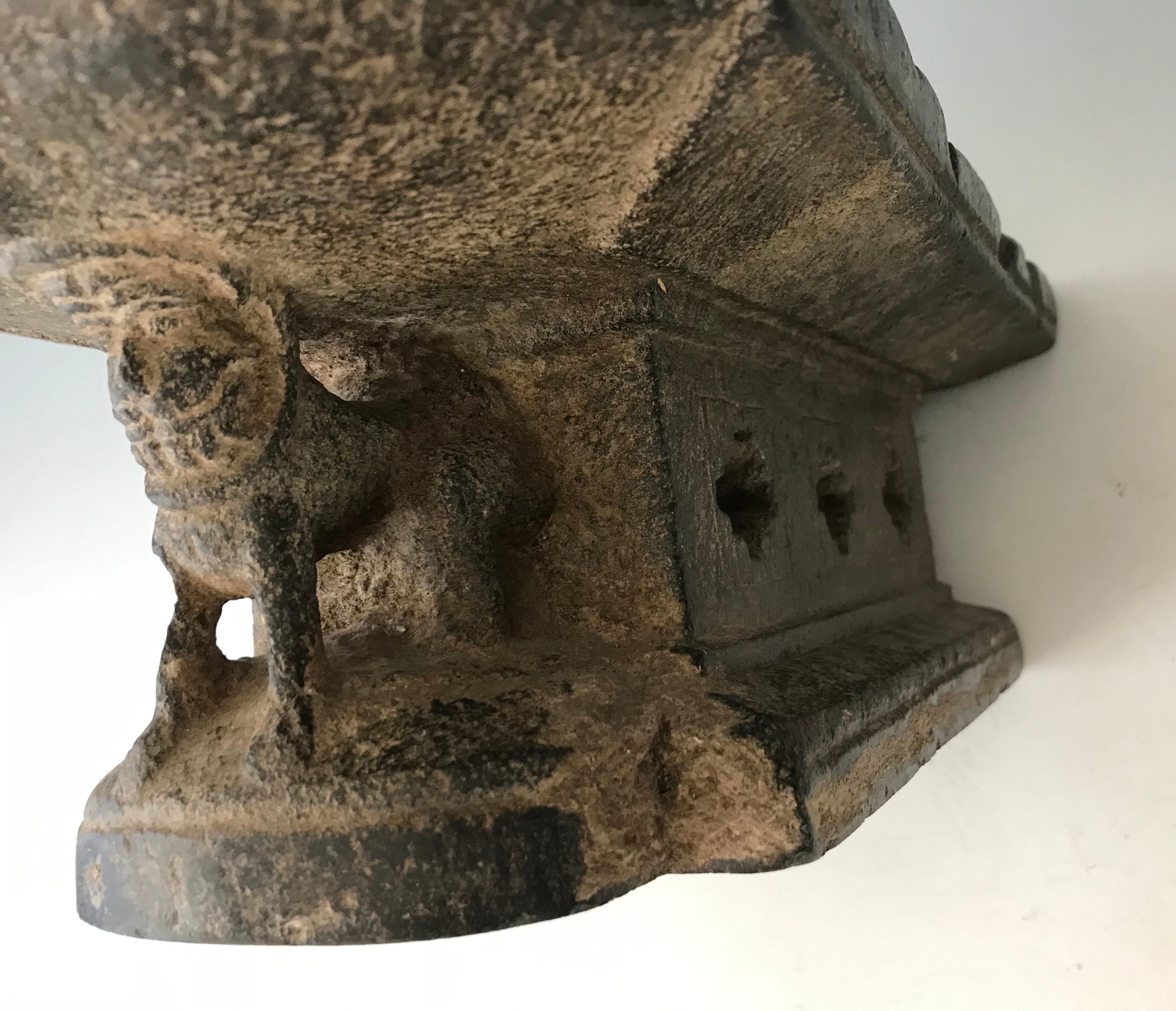 Large South Indian stone mortar Circa 12th C AD
A very rare Museum quality large schist stone mortar the underside hollowed carved with a row cross shaped holes to the interior, the curved front with a lion supporting the shaped upper lip section,