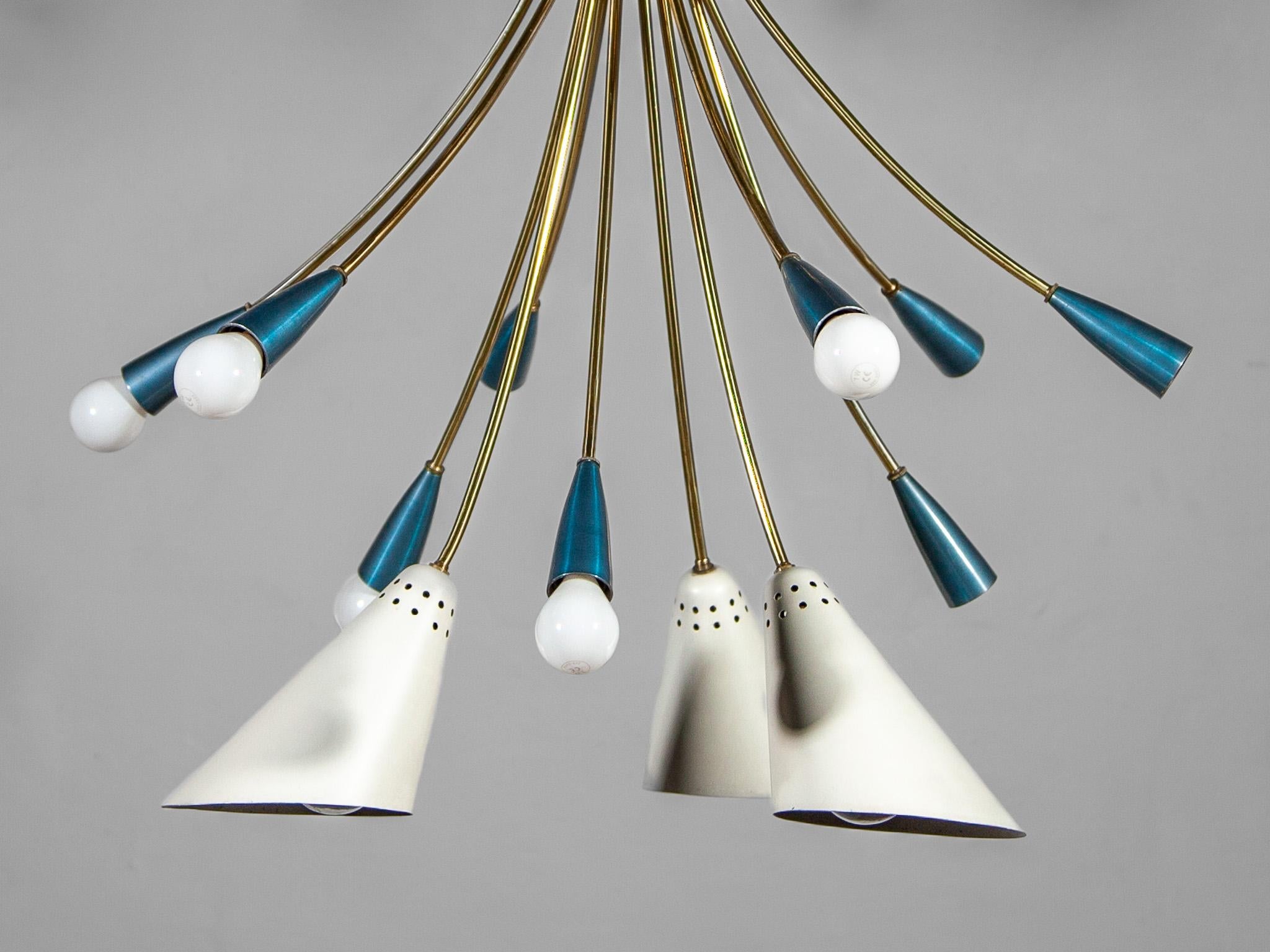 Characteristic large Sputnik chandelier very rare to find. German chandelier circa 1950 in the style of Stilnovo. This classic light fixture is comprised of twenty metallic blue shades for E14 standard screw bulbs and three white shades for E27