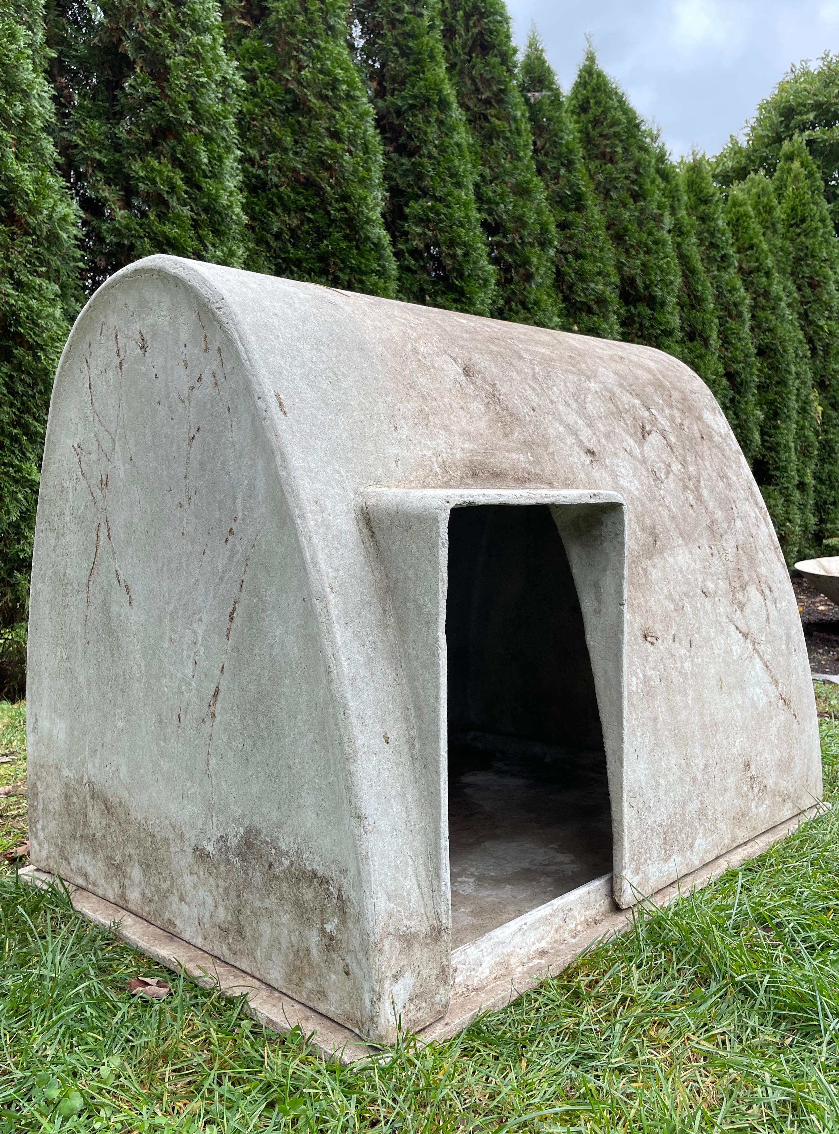 Designed by the iconic Willy Guhl in the 1960s and made of strong and lightweight fiber cement by Eternit, SA of Switzerland, this dog house with its original removable pan is the larger of two sizes designed by Guhl. It is in fabulous condition