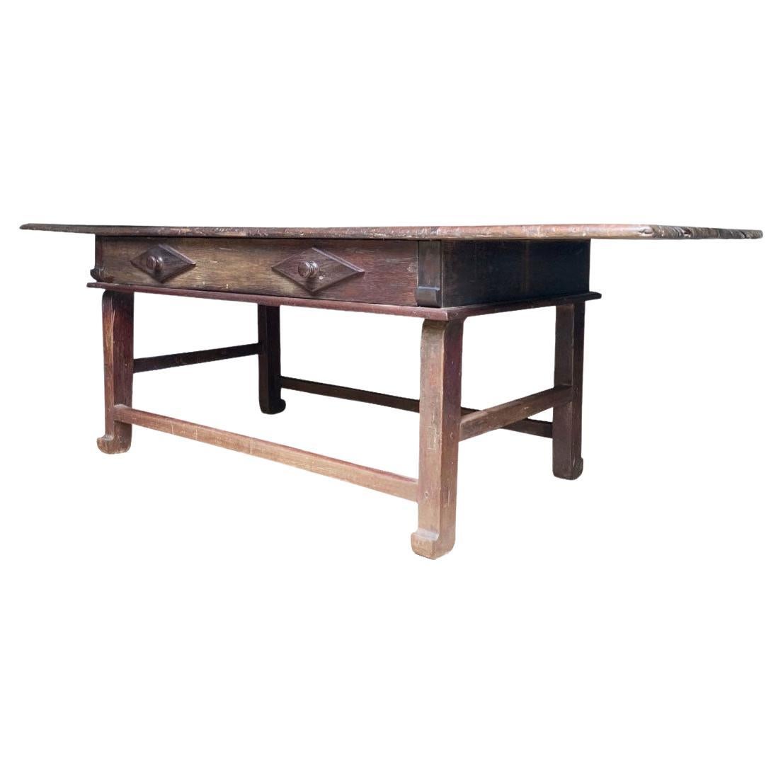 This remarkable dining table is a true example of late 18th-century Brazilian craftsmanship from the region of Minas Gerais, showcasing the influence of colonial design combined with local techniques. The table, made from solid hardwood, features a