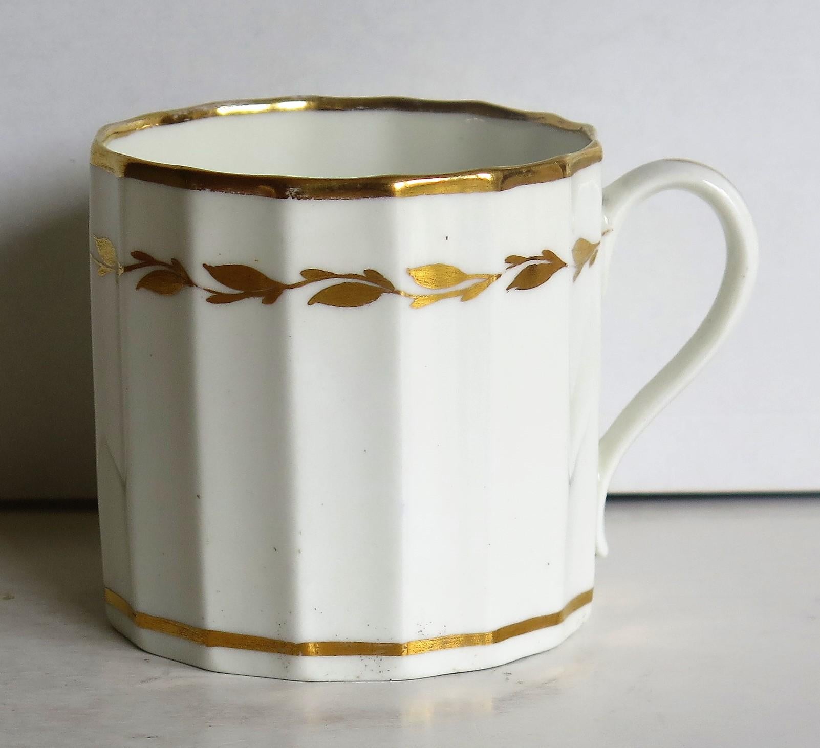 This is a rare and very collectable, hand-painted porcelain coffee can (cup), made by Derby Porcelain Co., England in the late 18th century, George III period, circa 1790.

The coffee can has a nominally straight sided body with 16 vertical concave