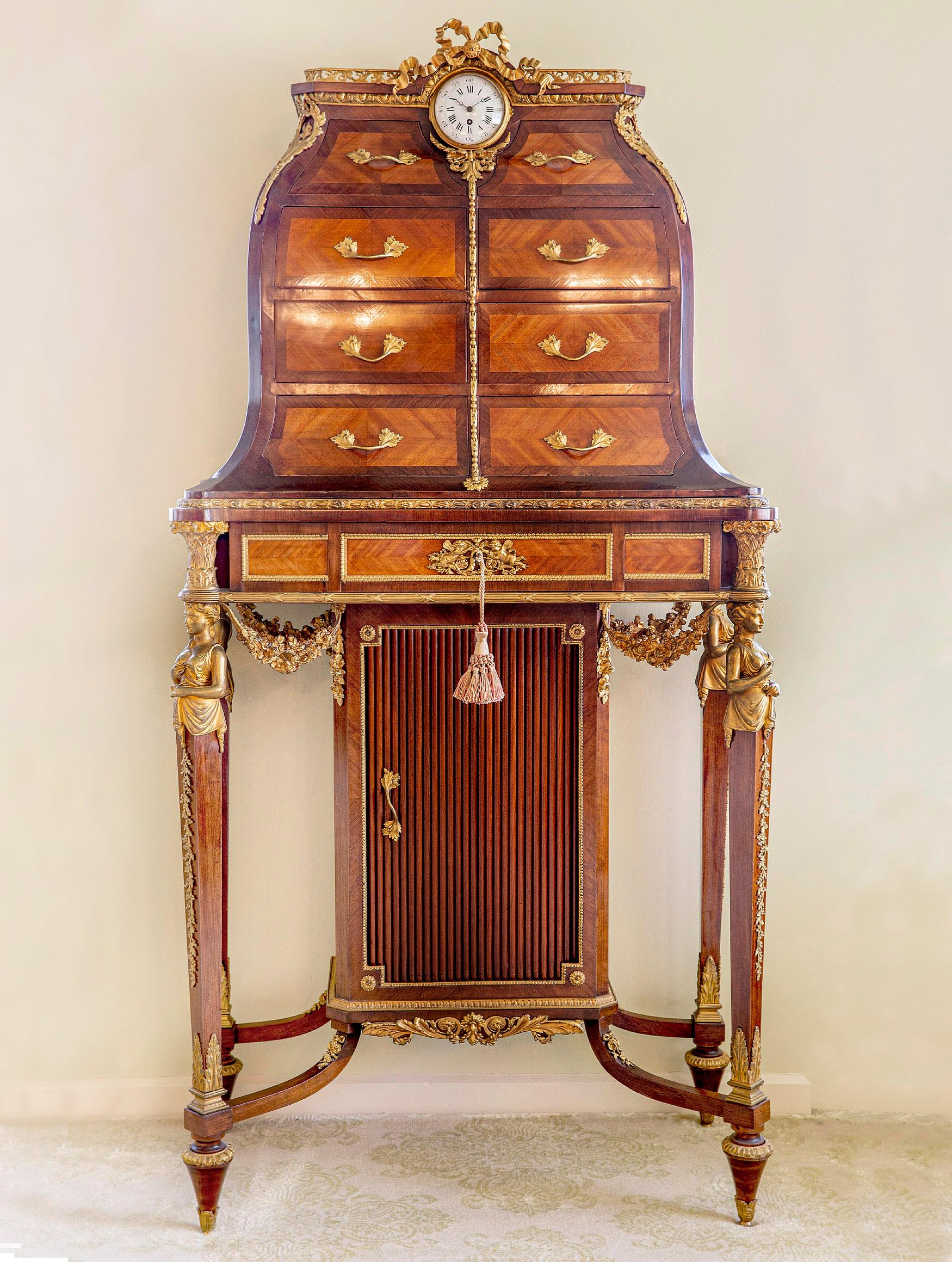 A Very Rare Late 19th Century Gilt Bronze Mounted Louis XVI Style Desk/Cabinet By François Linke

François Linke

The cartonnier top surmounted by a pierced guilloche acanthus gallery, centered with a clock and bronze bow, above eight drawers. the