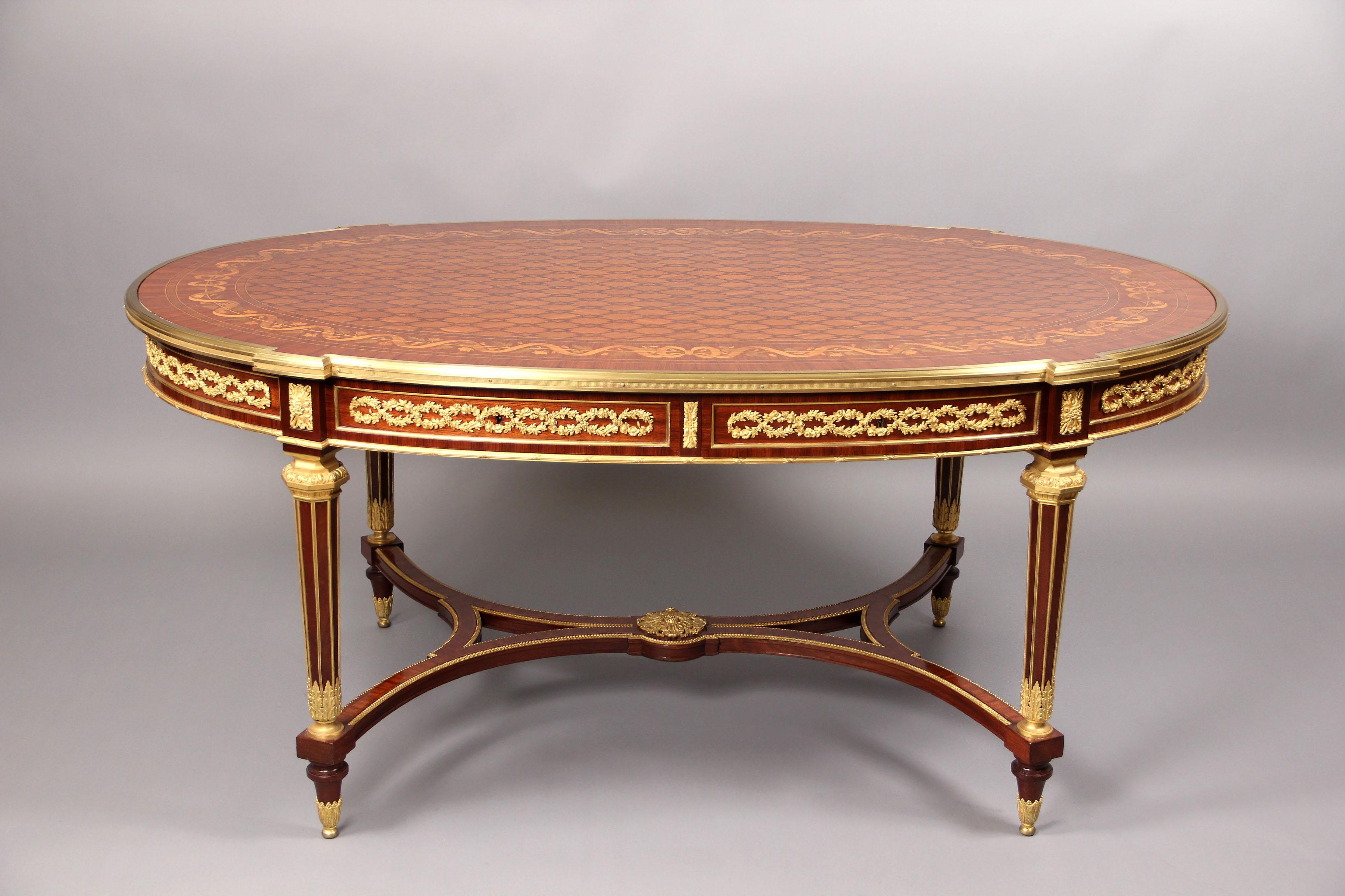 A rare and fantastic quality late 19th century Louis XVI style gilt bronze mounted inlaid marquetry and parquetry center table By Franc¸ois Linke.

Franc¸ois Linke.

The crossbanded oval top with central parquetry panel surrounded by floral and