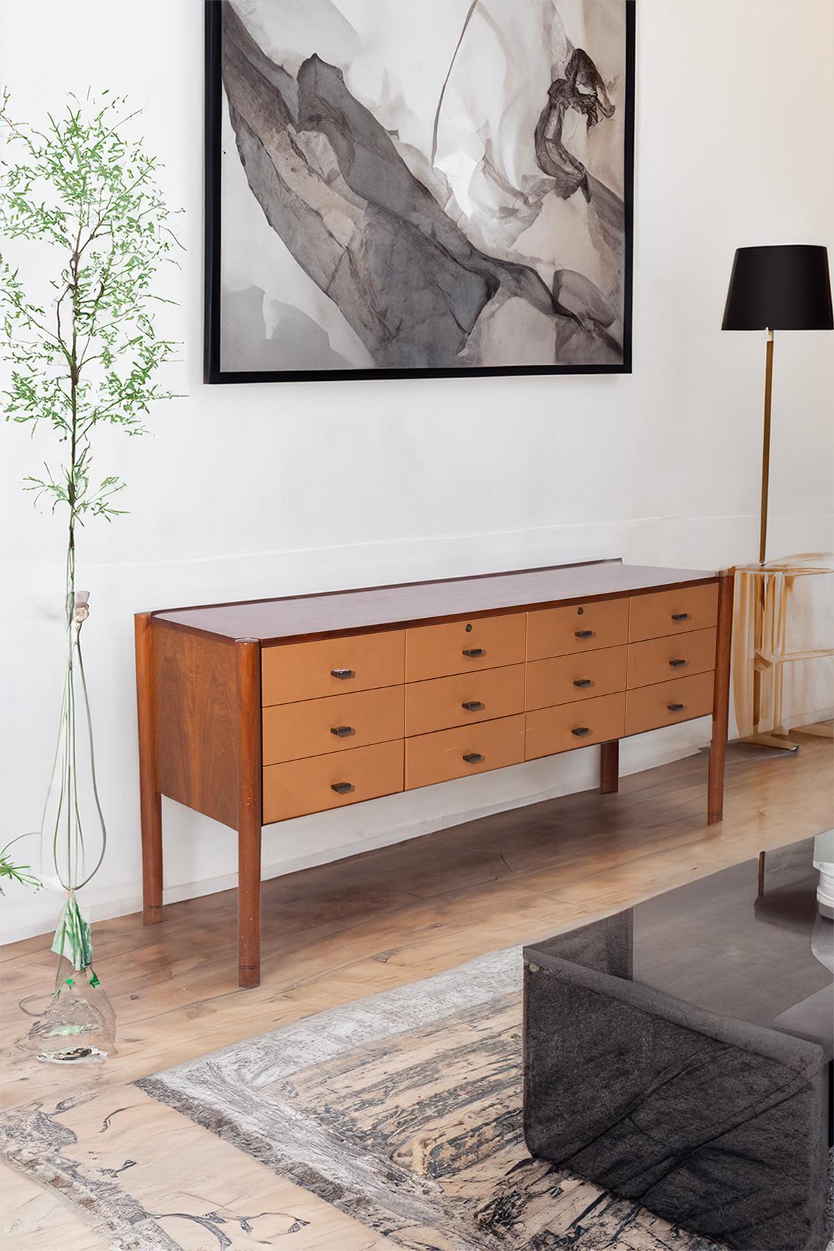 At the heart of vintage elegance lies a rare gem from the 1950s-60s: the Italian leather sideboard by the masterful Osvaldo Borsani. Precision crafted and imbued with timeless charm, this sideboard is a testament to Italian design at its best.
As