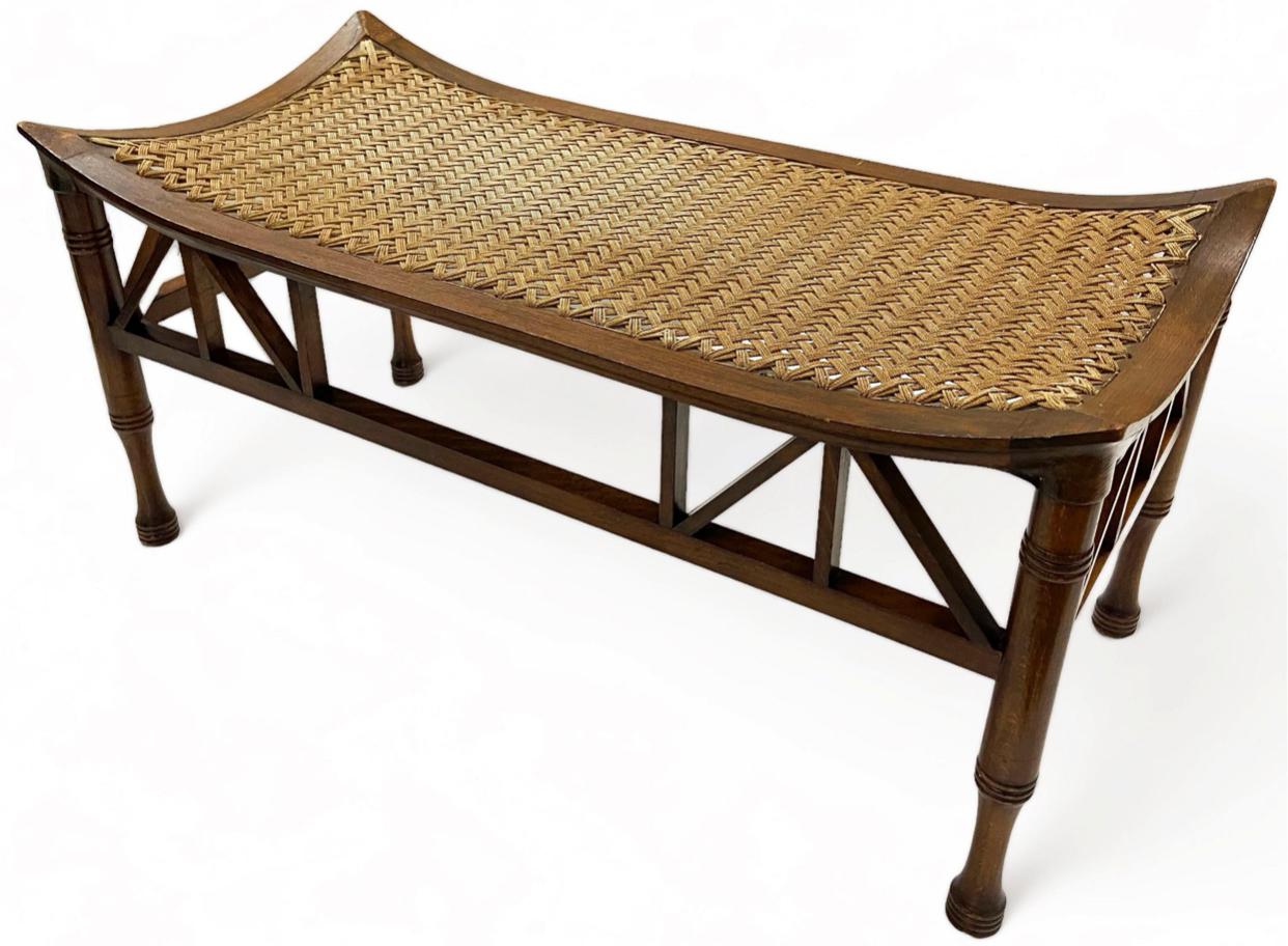 Extremely rare long form Thebes bench marketed by Liberty and Company, England Circa 1910. Constructed of beech wood and finely woven cane. There are many of these “types” of benches available in the short form, very very few of the long form. This