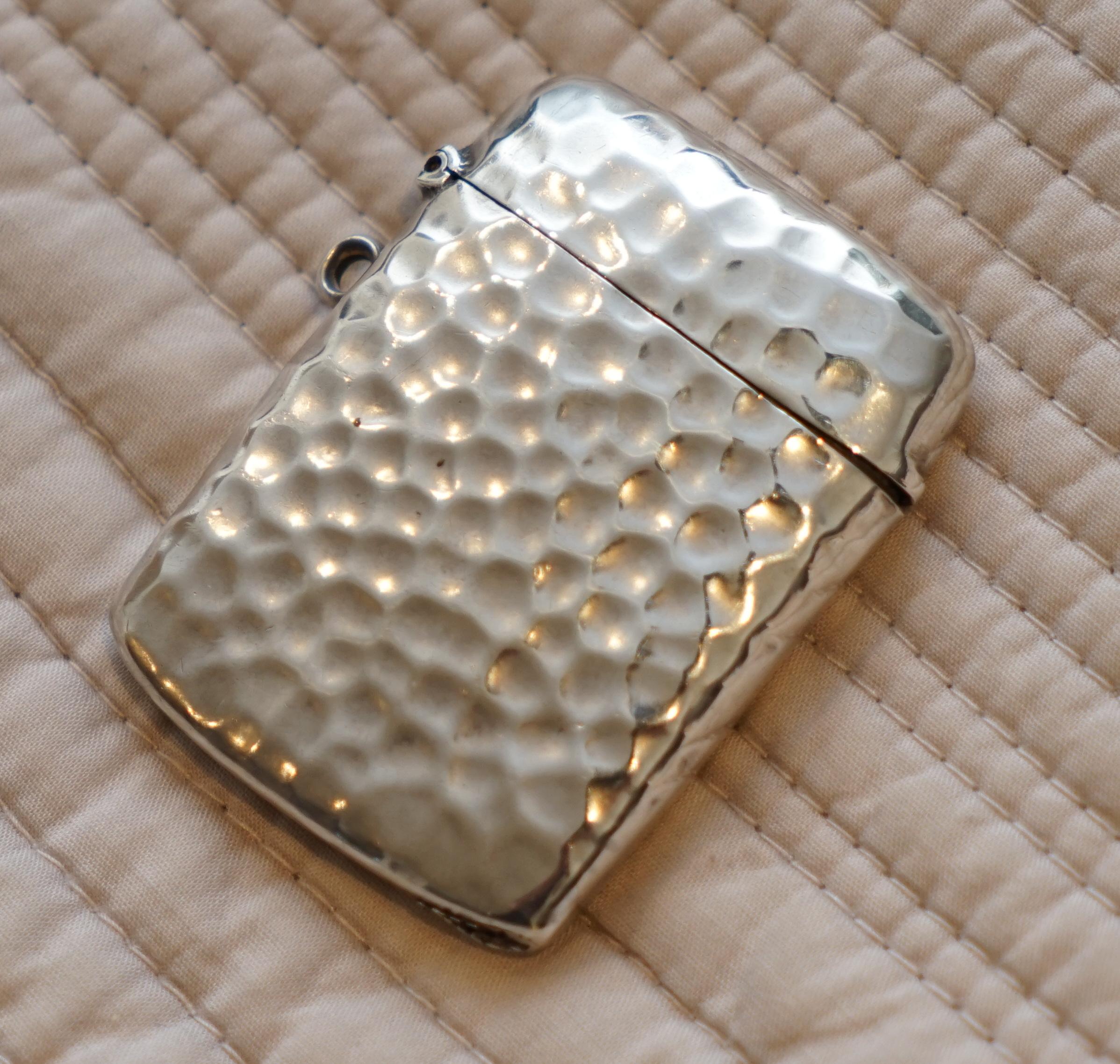 We are delighted to offer for sale this stunning very rare Liberty London 1899 hand hammered solid sterling vesta case made by William Hair Haseler

A very good looking decorative piece, its hand-hammered hence the lovely tactile finish, it opens