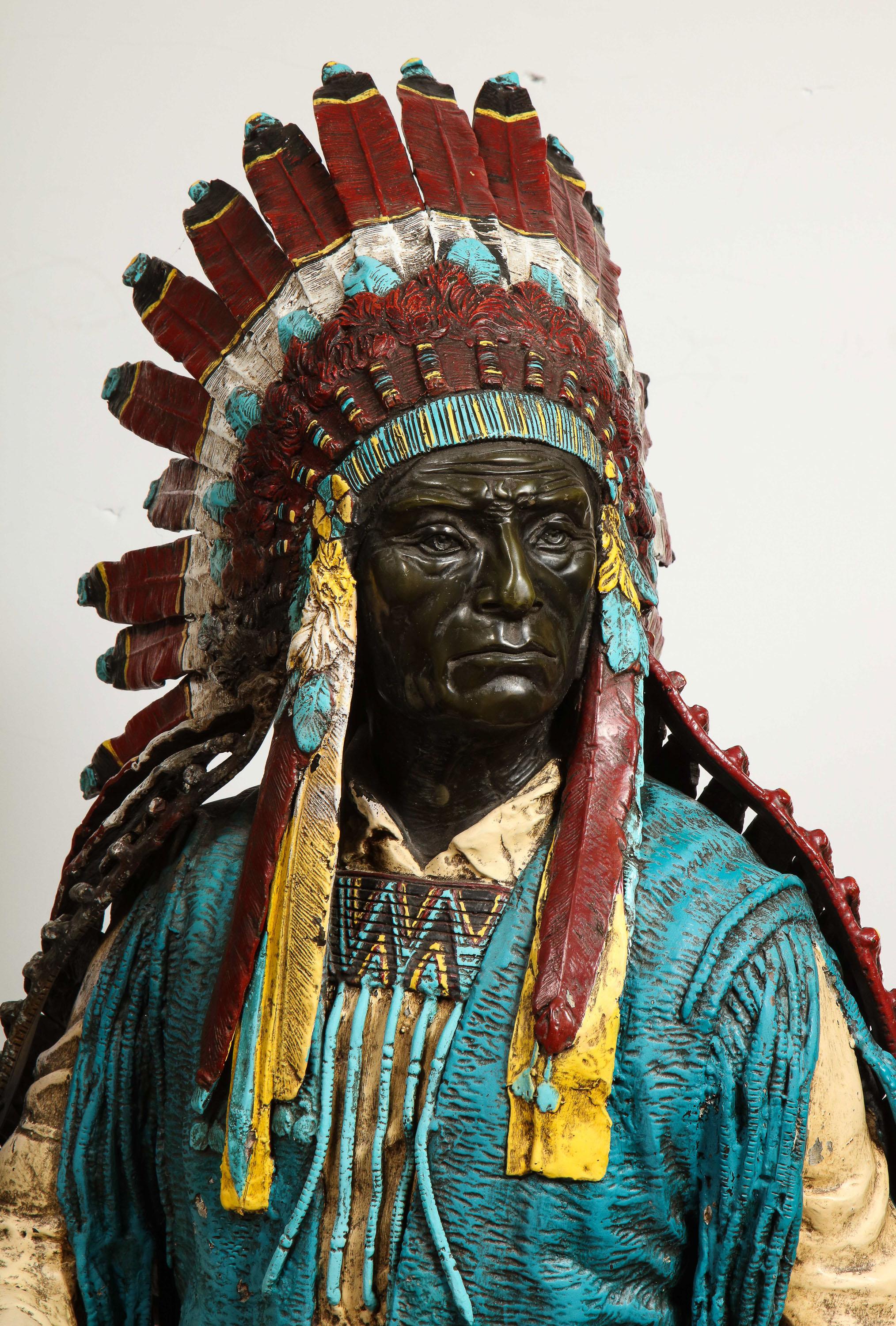 Near life-size polychrome bronze of a Native American Indian Chief after Carl Kauba, 20th century.

This magnificent quality bronze, stands 52
