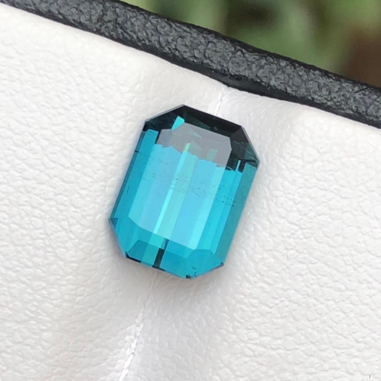 Exquisite 3.35 Carats Rare Blue Natural Tourmaline Loose Gemstone sourced from Afghanistan. This gem boasts a captivating emerald cut, revealing a stunning blue hue that is truly one-of-a-kind. Its magnificent luster and slightly included clarity