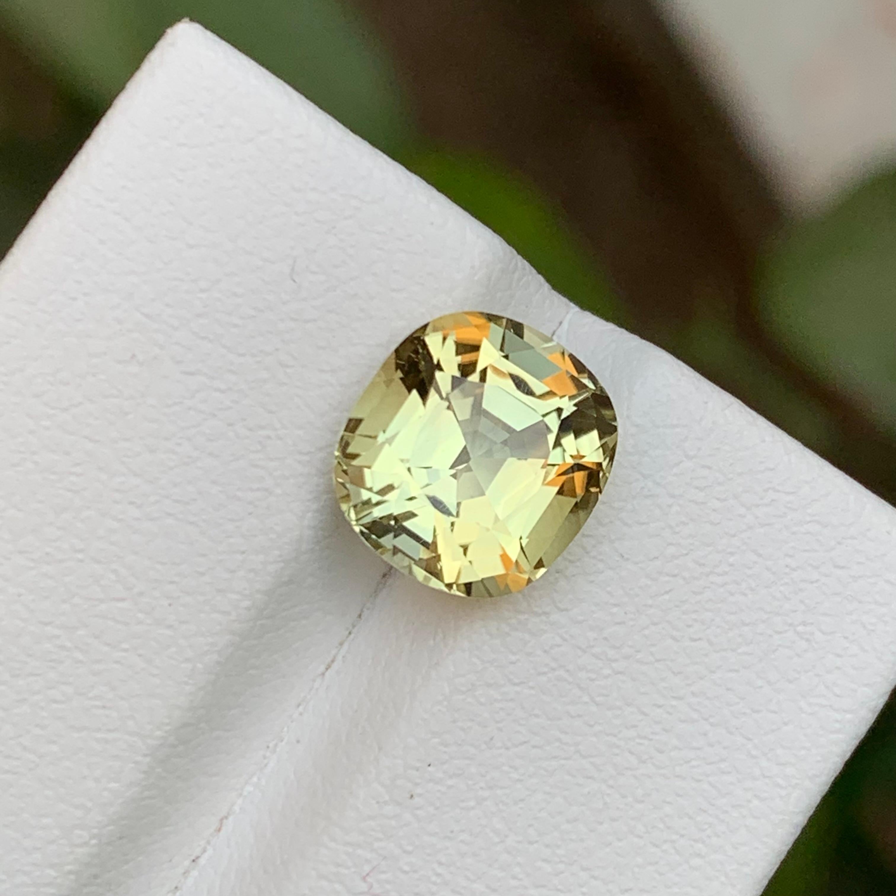 GEMSTONE TYPE: Tourmaline
PIECE(S): 1
WEIGHT: 4.15 Carat
SHAPE: Cushion
SIZE (MM):  9.97 x 9.24 x 6.79
COLOR: Light Golden Yellow
CLARITY: Eye Clean
TREATMENT: Not treated
ORIGIN: Afghanistan
CERTIFICATE: On demand

This dazzling 4.15 carat natural