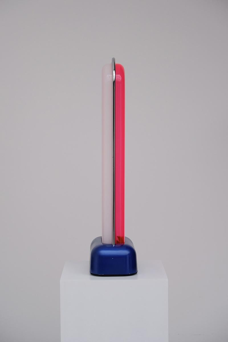 Rare light object by Ettore Sottsass
One side pink, translucent on the other
Black-lacquered aluminium stand, chromed metal bow, acryl, neon
Original sticker 'Design Centre, Made in Italy

Ettore Sottsass (Innsbruck, Austria 14 September 1917 –