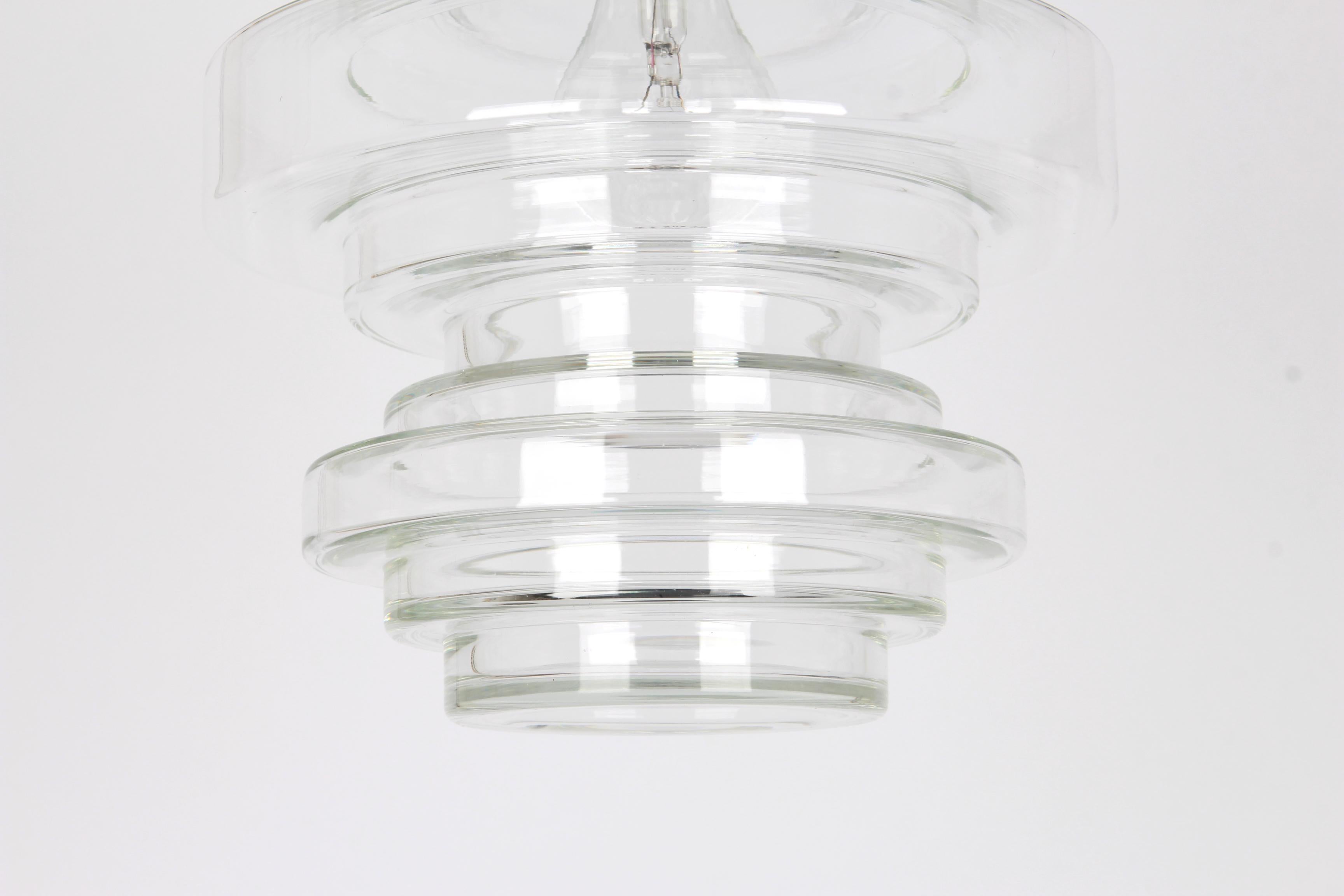 Rare clear glass pendant, manufactured by Limburg, Germany, circa 1970-1979.
Wonderful light effect and great shape.
Sockets: One x E27 standard bulb (max. 100 Watts) and compatible also with the US standards

Measures: Diameter 23 cm // 9