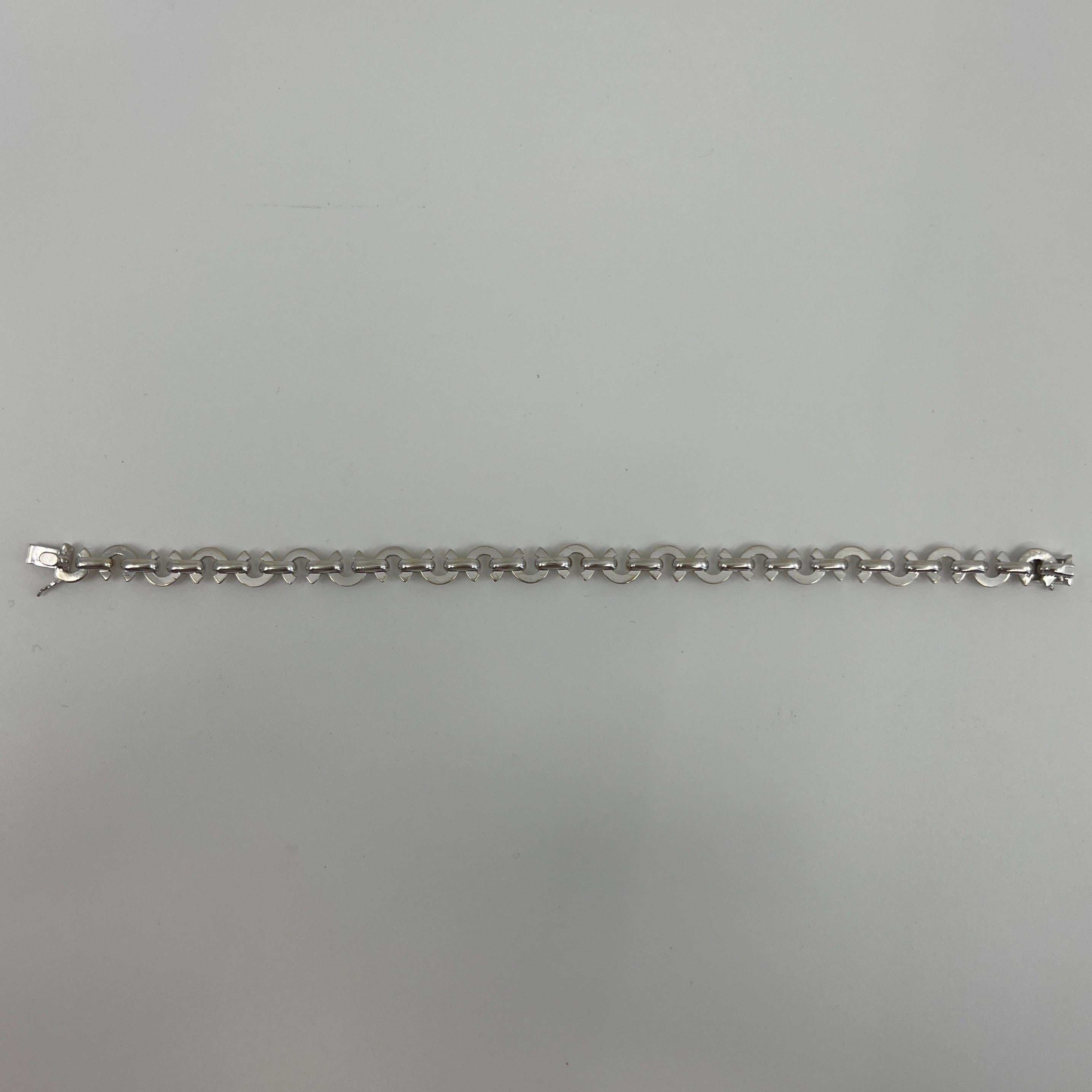 Chanel C Link Charm 18k White Gold Bracelet.

Rare limited edition Chanel C link 18k white gold bracelet with original box. 
Beautiful interlocking 'C' links.
Bracelet measures 20cm - 8 inches. 
Weighs 23.29g.

A larger size on bracelets like this