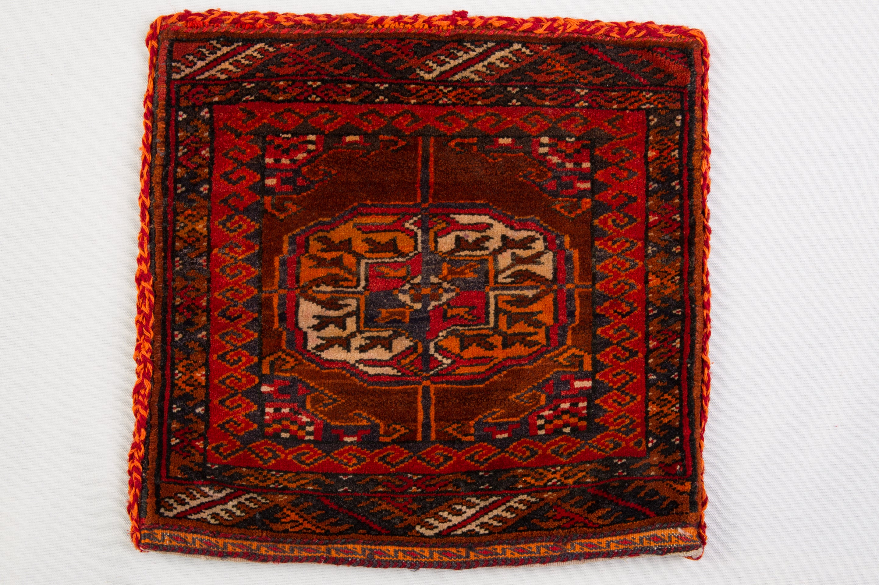 nr. 1056 - Rare little Bokara Tekke, recovered from an ancient saddlebag. Originally it was double: who knows where its half has gone... You can hang it on the wall, as a newspaper container or other; or slip a pillow into it and put on the chair