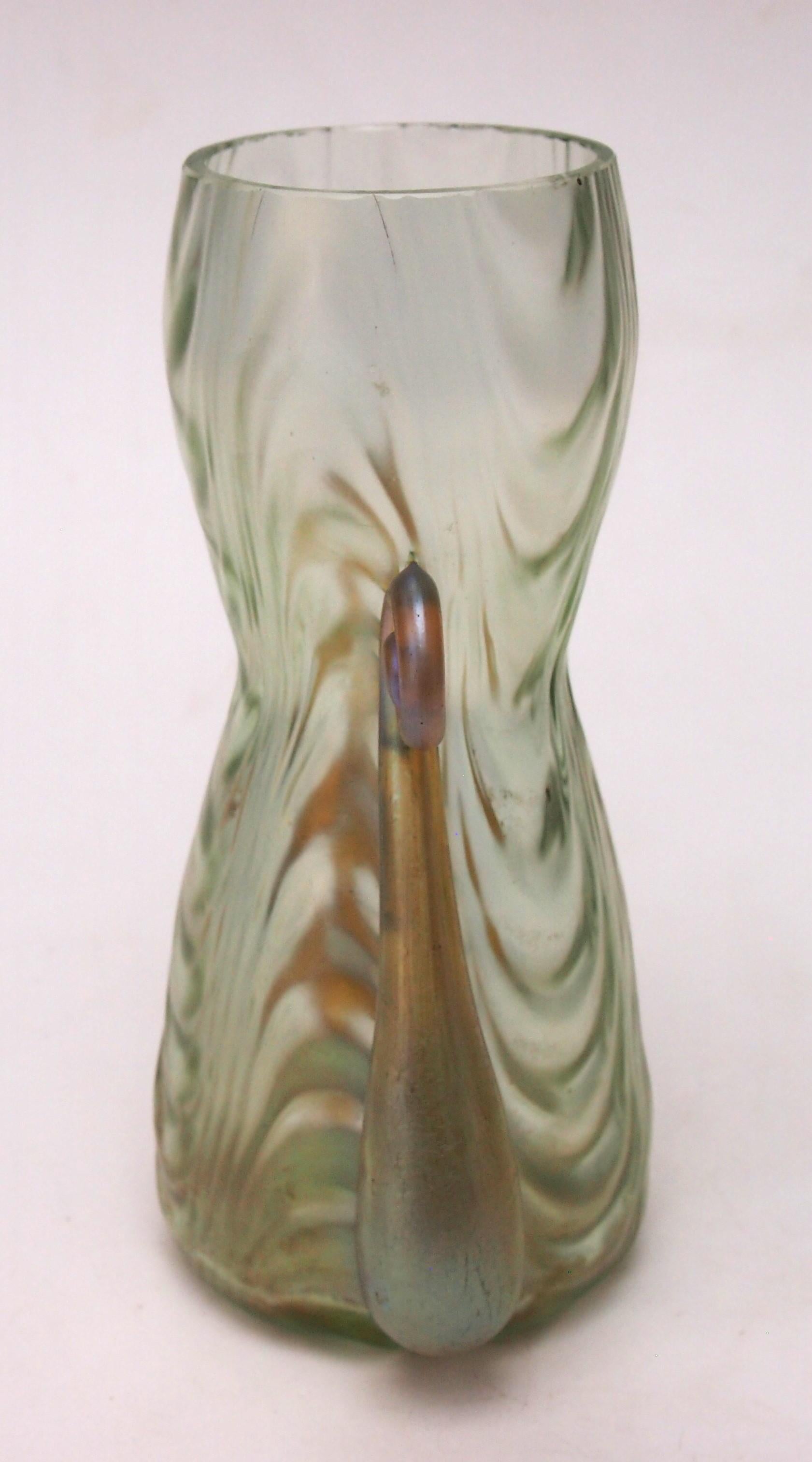 Rare Loetz Coppelia pattern vase with two hot applied Candia (iridised gold) handles with over curled tops and a pale green body with a distinct wave optic pattern. Coppelia is one of the rarer patterns from the Series II period (ie early years of