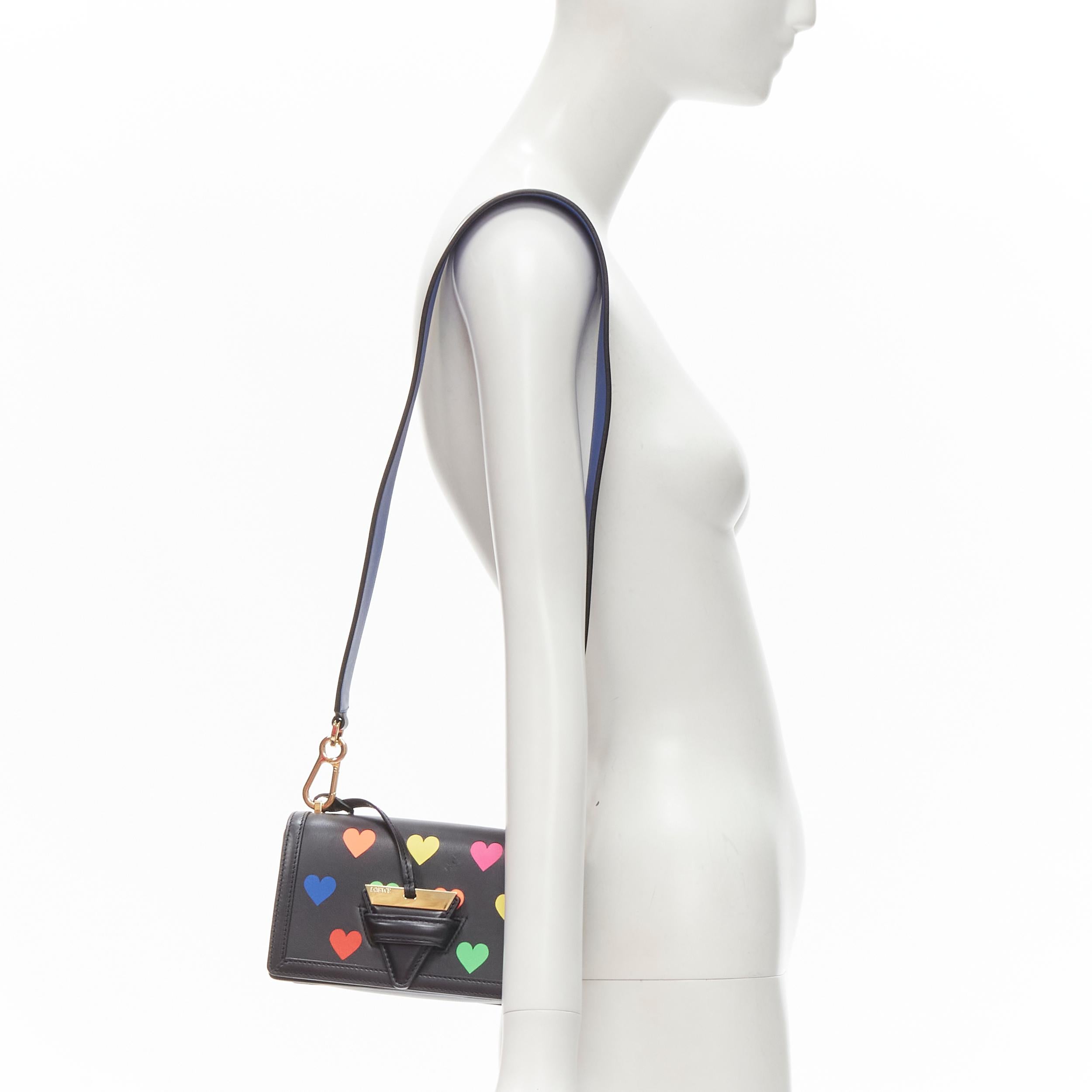 rare LOEWE Barcelona black leather neon heart print crossbody bag 
Reference: ANWU/A00045 
Brand: Loewe 
Model: Barcelona 
Material: Leather 
Color: Black 
Pattern: Heart 
Extra Detail: Limited edition black calfskin with neon heart print. Gold-tone