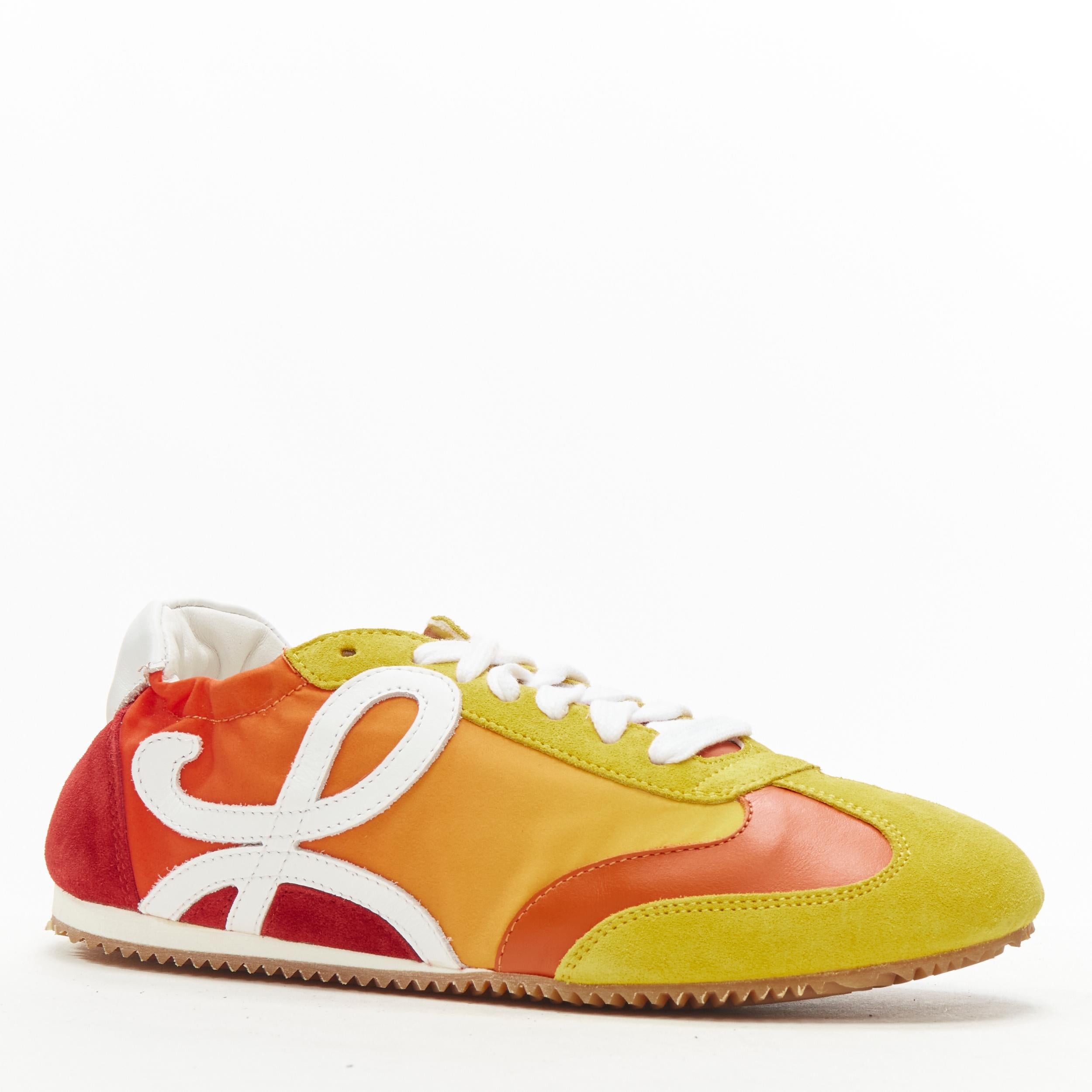 rare LOEWE Flow sunset red yellow gradient low top runner sneaker EU37 
Reference: ANWU/A00323 
Brand: Loewe 
Designer: JW Anderson 
Model: Flow 
Material: Fabric 
Color: Orange 
Closure: Lace 
Extra Detail: Suede and leather trim. Fabric body.