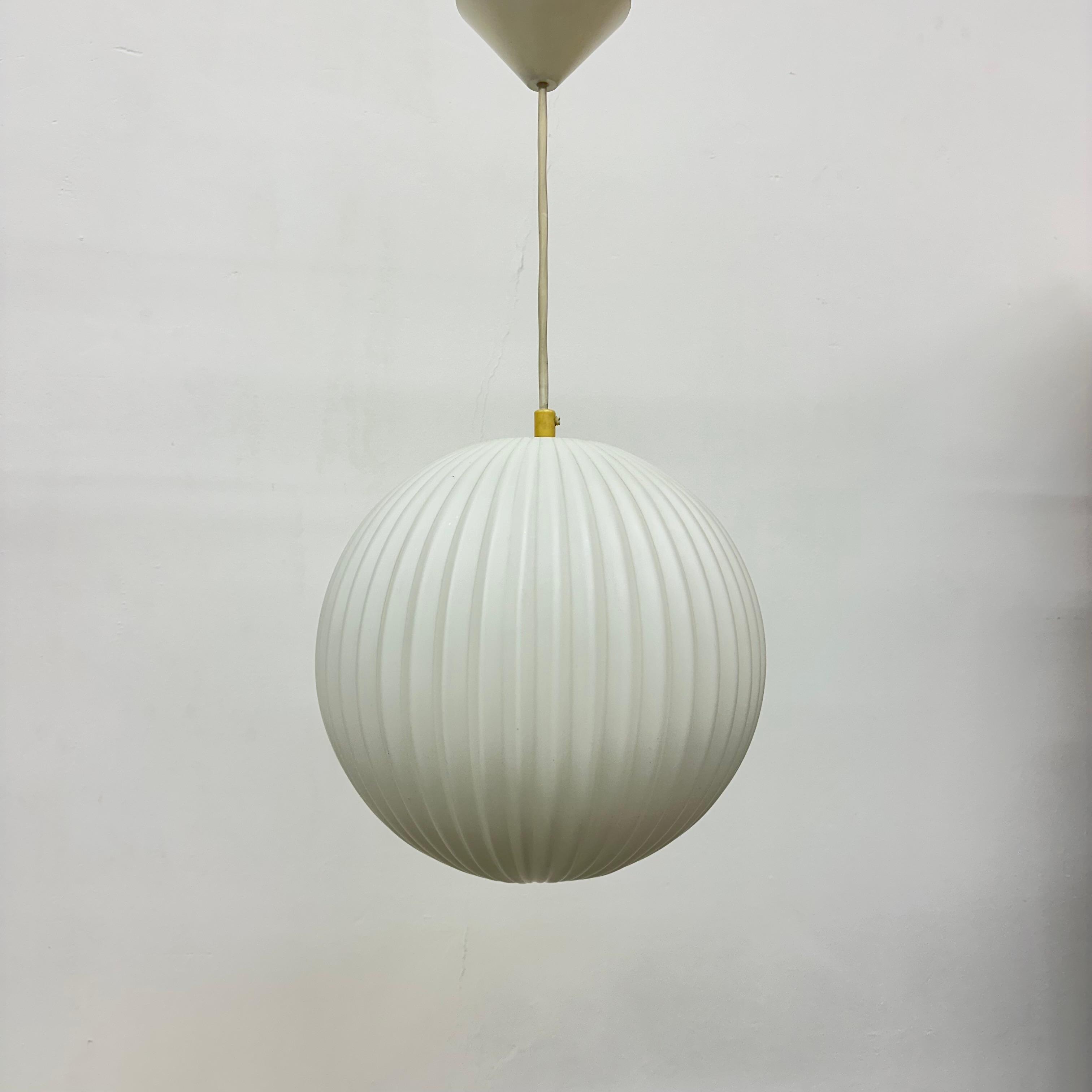 Glass Rare Louis Kalff for Philips Opaline glass pendant light , 1960s For Sale