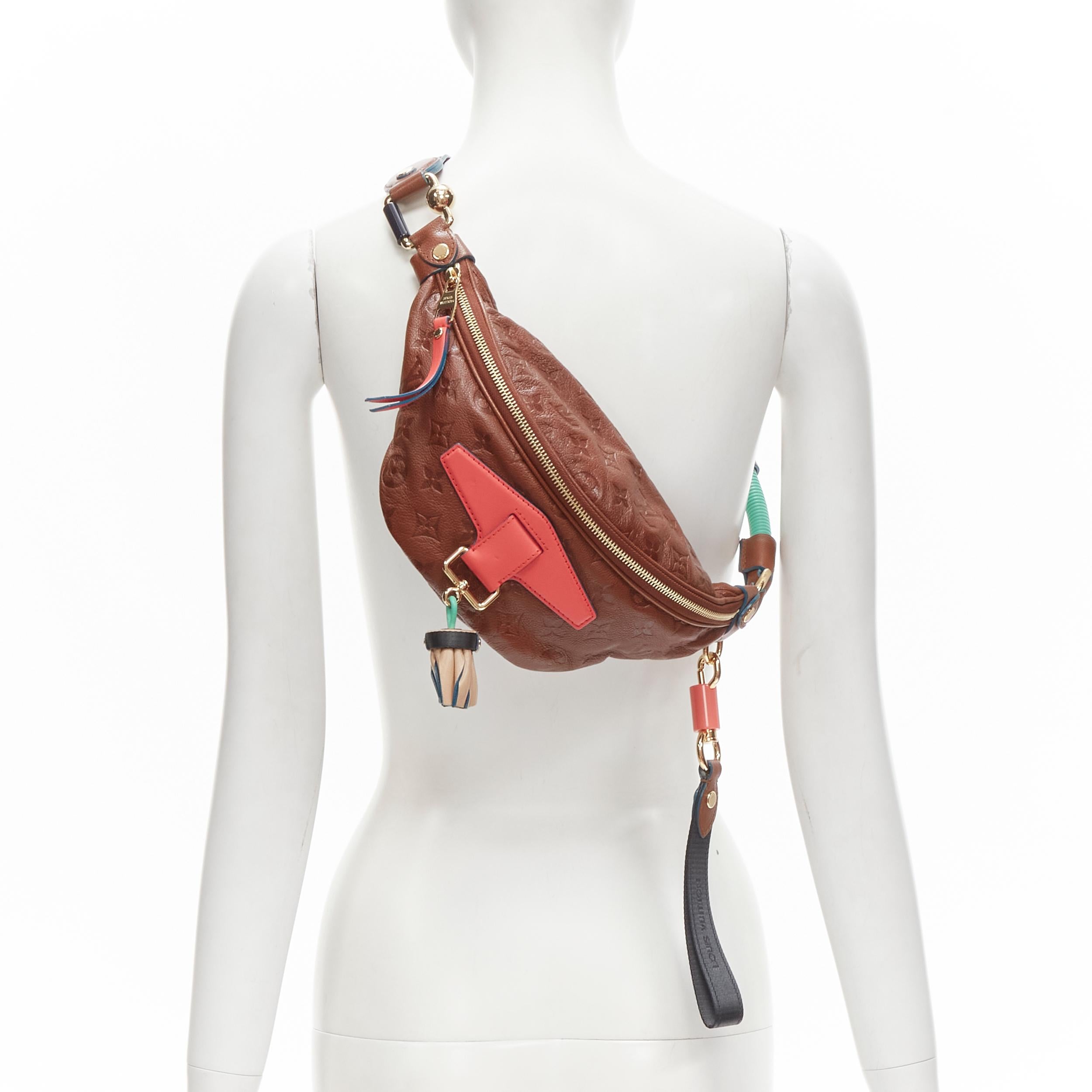 rare LOUIS VUITTON 2010 Underground Punk tassel brown monogram waist bag 
Reference: ANWU/A00042 
Brand: Louis Vuitton 
Designer: Marc Jacobs 
Collection: Spring Summer 2010 Underground Runway 
Material: Leather 
Color: Brown 
Pattern: Solid