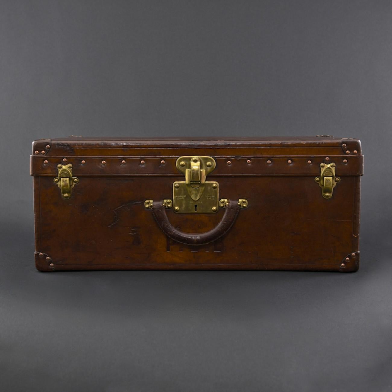 A rare leather Louis Vuitton case made specifically to carry shoes/boots. With brass fittings and felt lined interior; circa 1910. Originally there would have also been a felt lined tray.

Louis Vuitton was founded by its namesake in 1854, with the